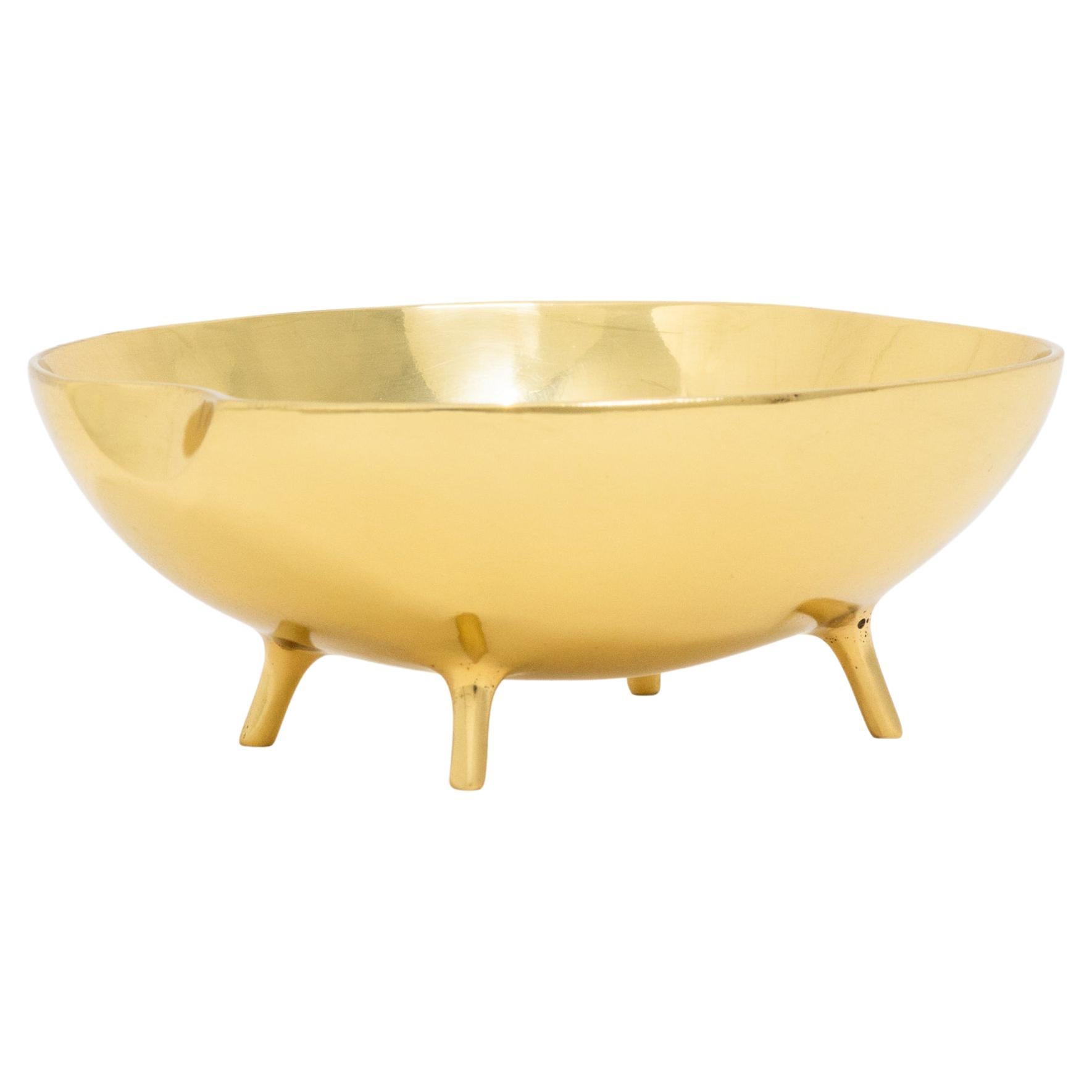 Handmade polished cast brass bowl with legs, vide-poche.

Each of those original and elegant bowls are handmade individually. Cast using very traditional techniques.

Slight variations in polished finishes, patterns and sizes are characteristics of