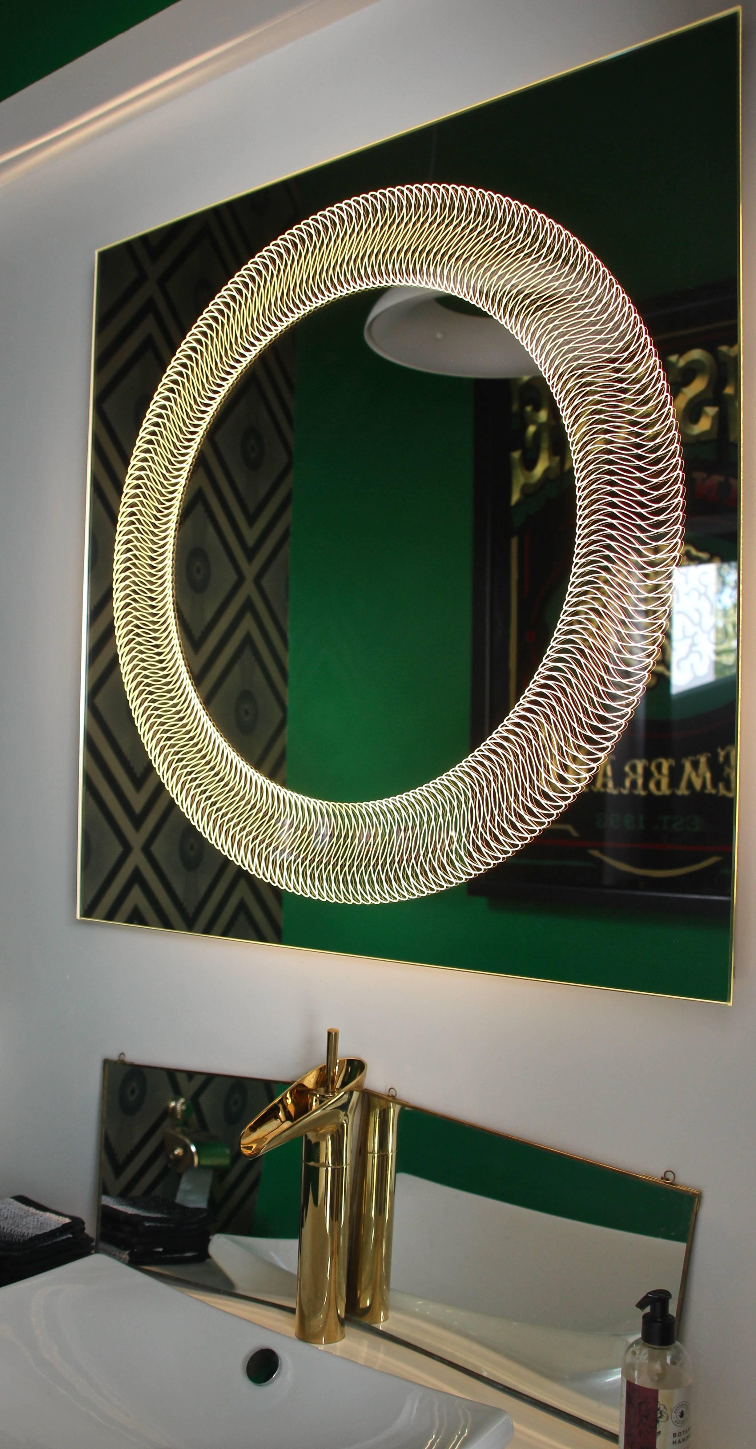 This item is available now at a special 20% discount. It may be packed and shipped within 3 days of receiving an order.

The Glazz Cosmic mirror adorns a stunning circular pattern that comes alive when back-illuminated. Light also beautifully shines