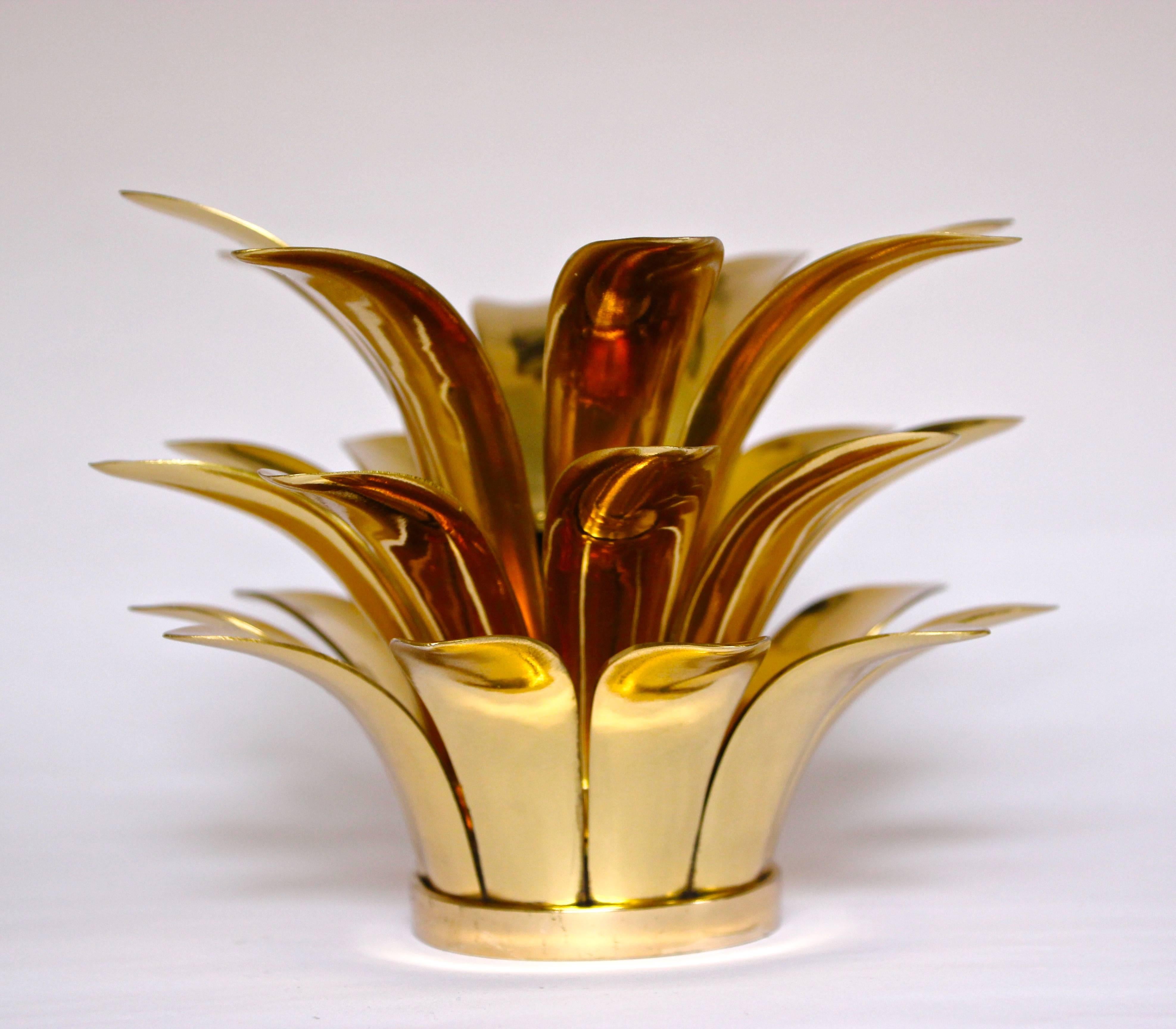 Charming and ingenious handmade cast polished brass candle holder inspired by a pineapple. May be used with tapered candles or T-lights.

Handmade individually. Cast using very traditional techniques, those original candleholders are polished