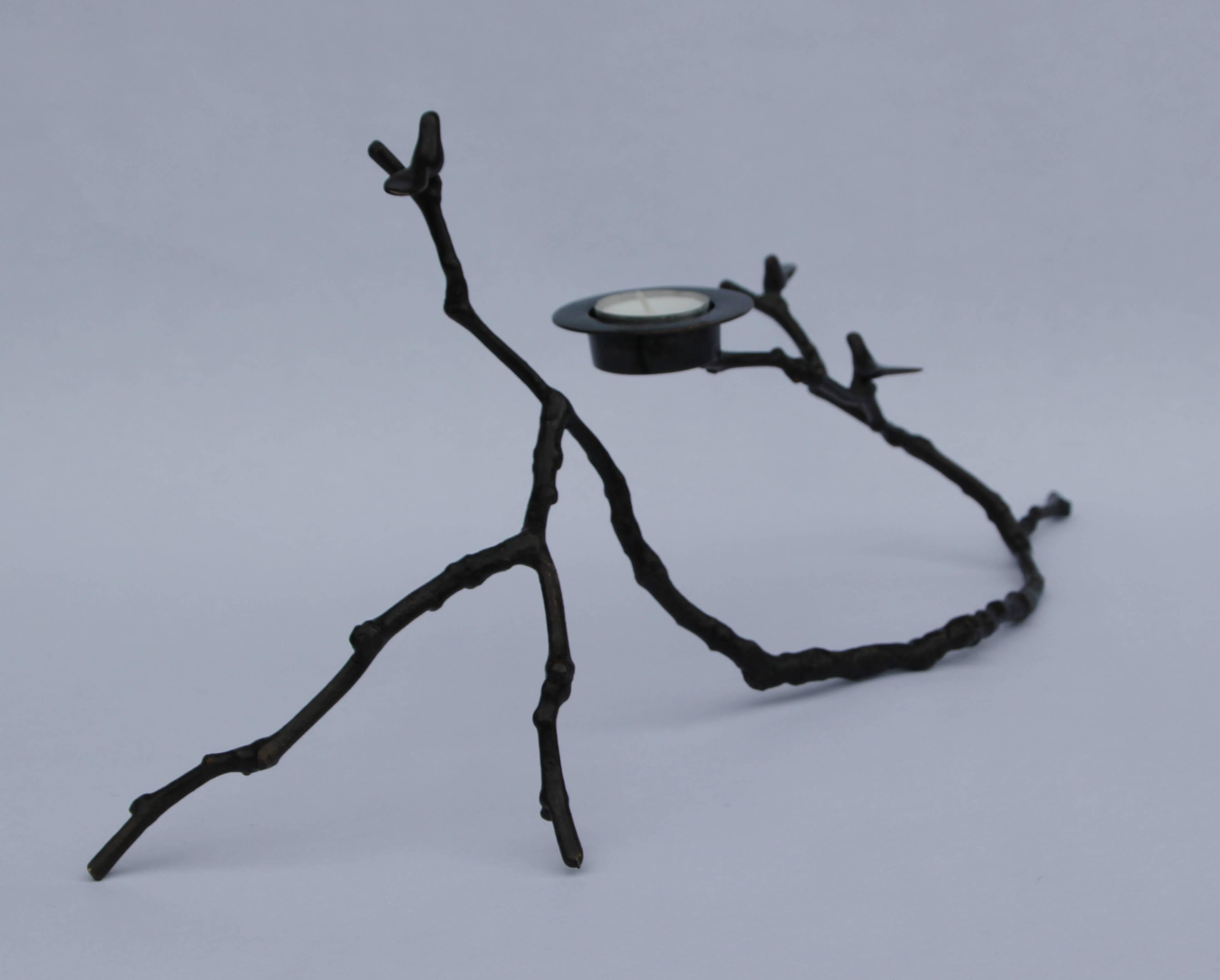 Original, unique and made of brass with a dark patina finish, creating sumptuous and unusual decorative elements for beautiful homes.

Each of these splendid patina Magnolia Twig T-light holders is handmade individually with incredible detail.