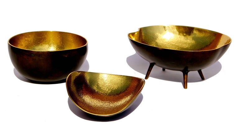 Created by The Design Foundry. Handmade cast brass bowls with a patina finish.

Brass Bowl with Legs: w 14 cm x d 12 cm x h 6 cm

Brass Shallow Bowl: w 10 cm x d 1.1 cm x h 4.5 cm

Small Brass Bowl: w 10.5 cm x d 1.1 cm x h 6 cm

Each of those