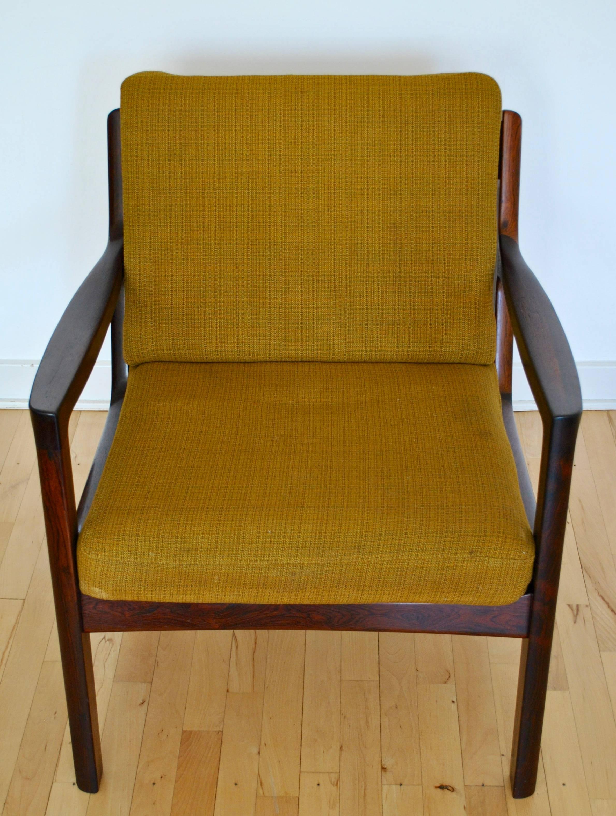 Elegant mahogany armchair produced by Frances & Son and designed by Ole Wanscher (1903-1985) in 1960s. Stamped and production number 6530067.
Really comfortable to sit in.
Original wool cushions in an mustard-oliven green color. Cushions can be