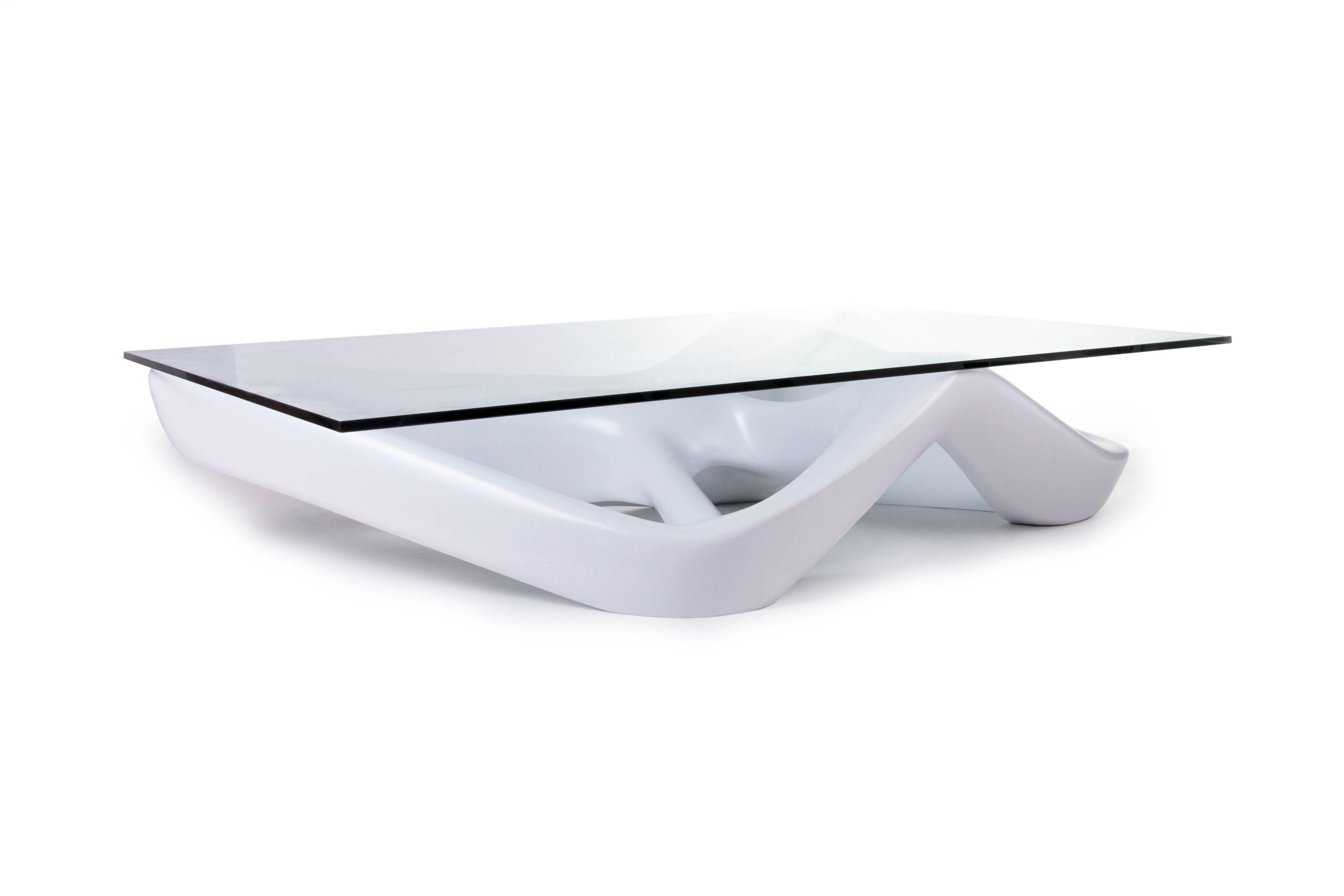 Net coffee table is a futuristic sculptural art table with a dynamic form designed and manufactured by Amorph. Net could be fitted in modern homes or offices or any spaces featuring as a contemporary style piece. Net is made out of a MDF matte white