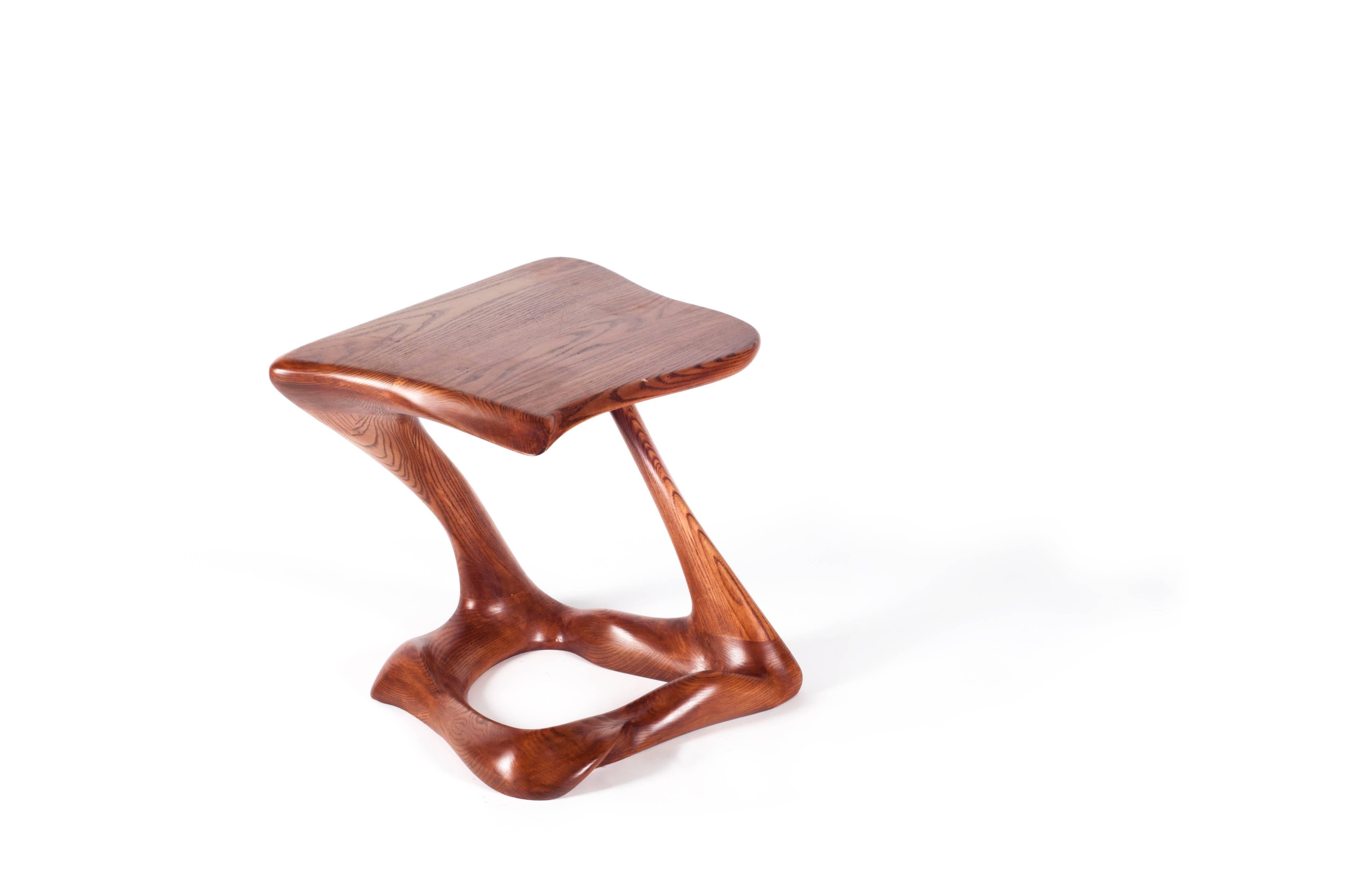 Side table (Tryst) is a stylish futuristic sculptural art table with a dynamic. Tryst could be fitted in modern homes or offices featuring as a contemporary style art piece. Tryst is made out of solid ash wood with dark walnut stain. By the nature,