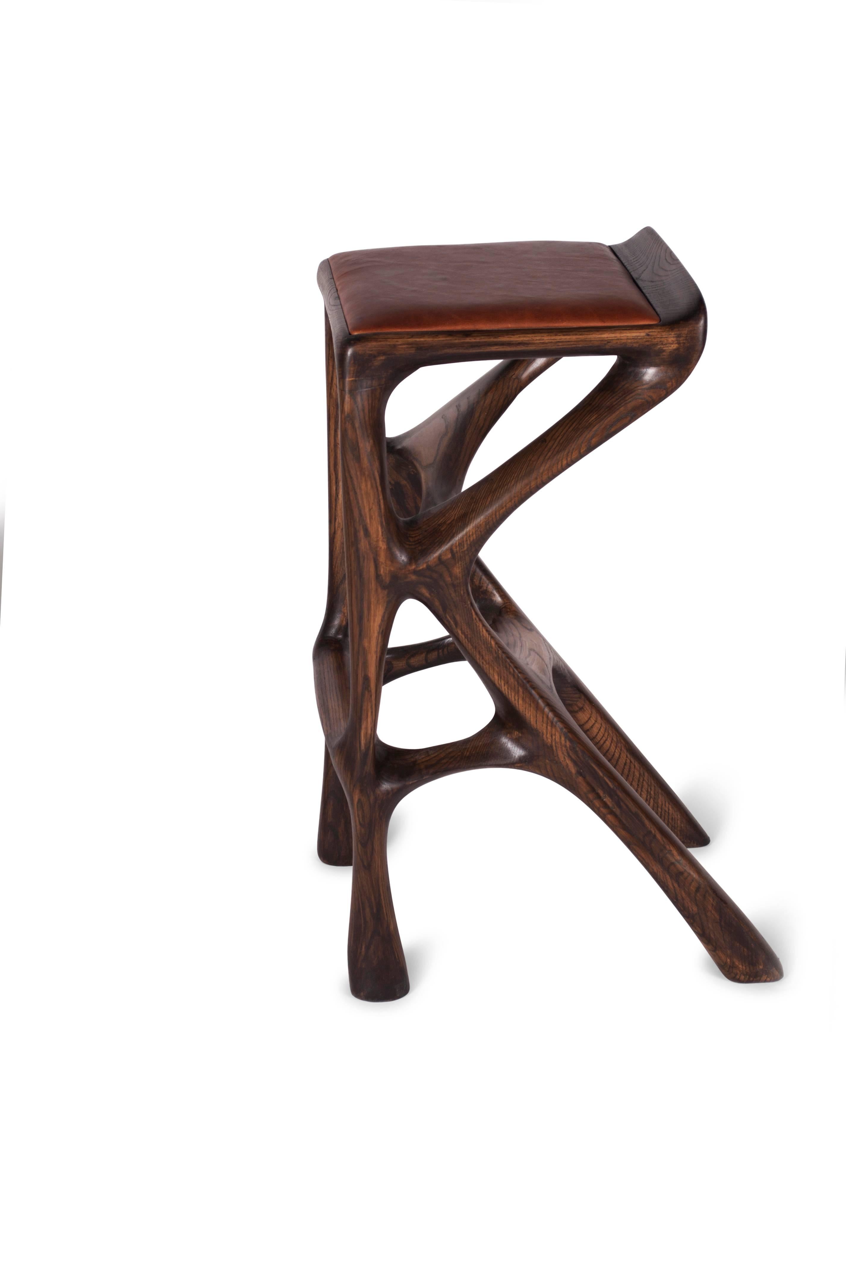 Barstool designed by Amorph made out of solid ash wood and leather. Stain color: Rusted walnut
Dimension 31