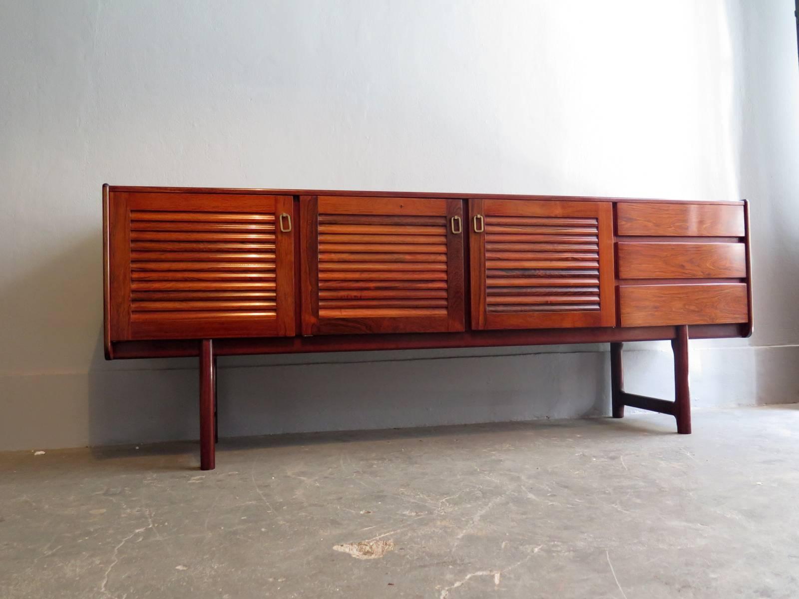 McIntosh rosewood with brass handlers sideboard. Elegant design, beautiful grain.