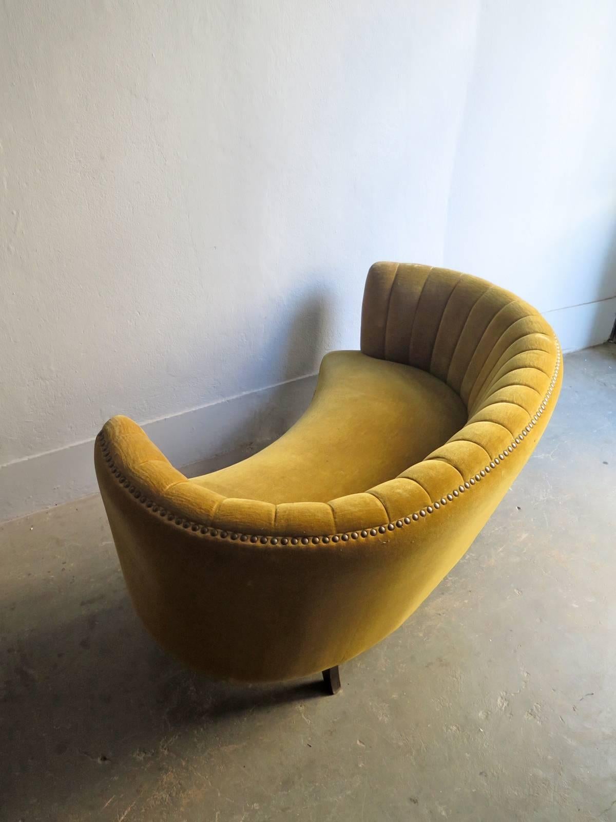 Art Deco mustard yellow velvet two seats charming sofa with teak legs.