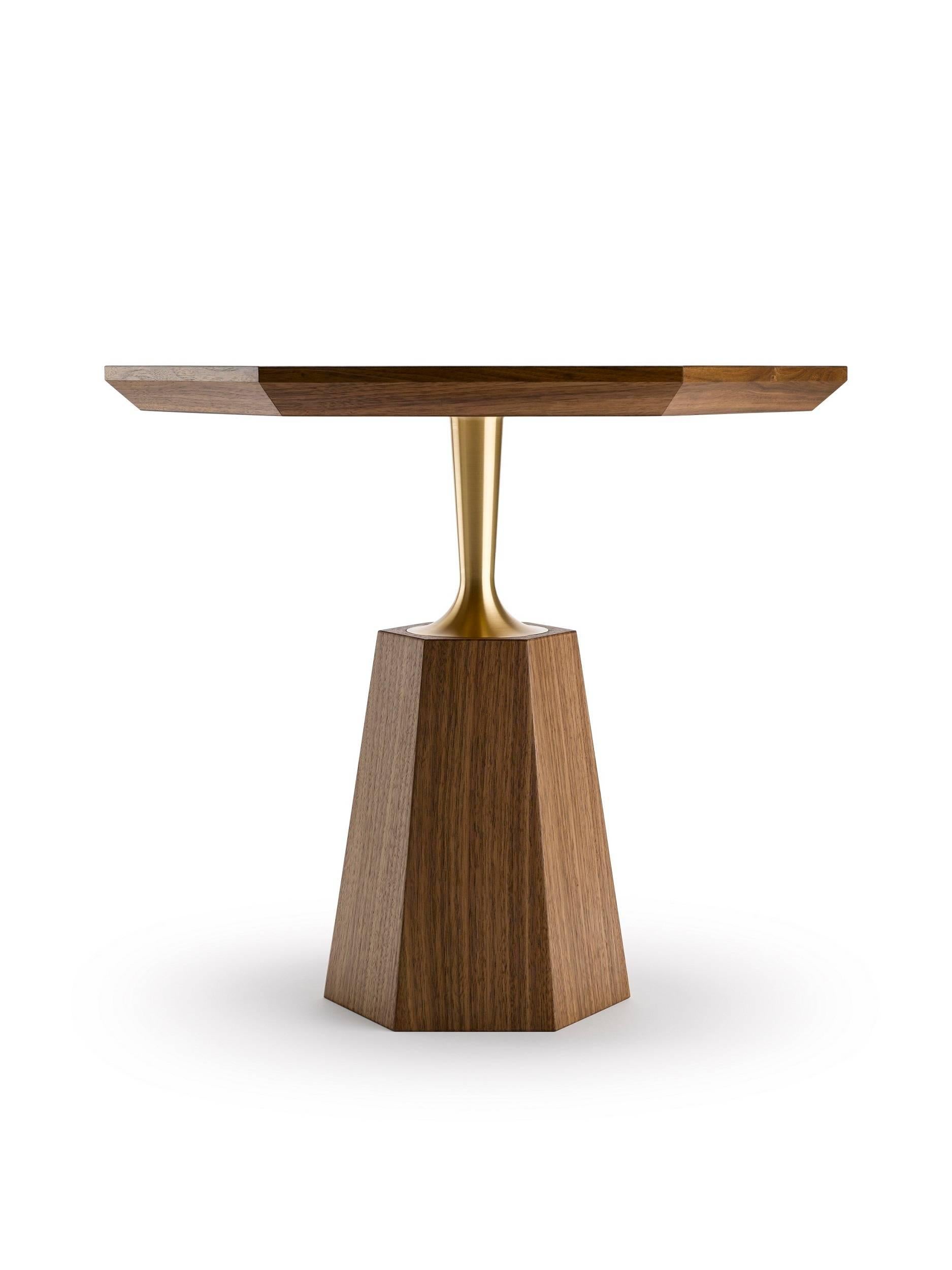The Hex Occasional Table has a hexagonal tapering base giving rise to a precision engineered brass neck that supports a hexagonal top, shown here in natural oiled walnut and machine turned solid brass.
The brass is available in either a natural or