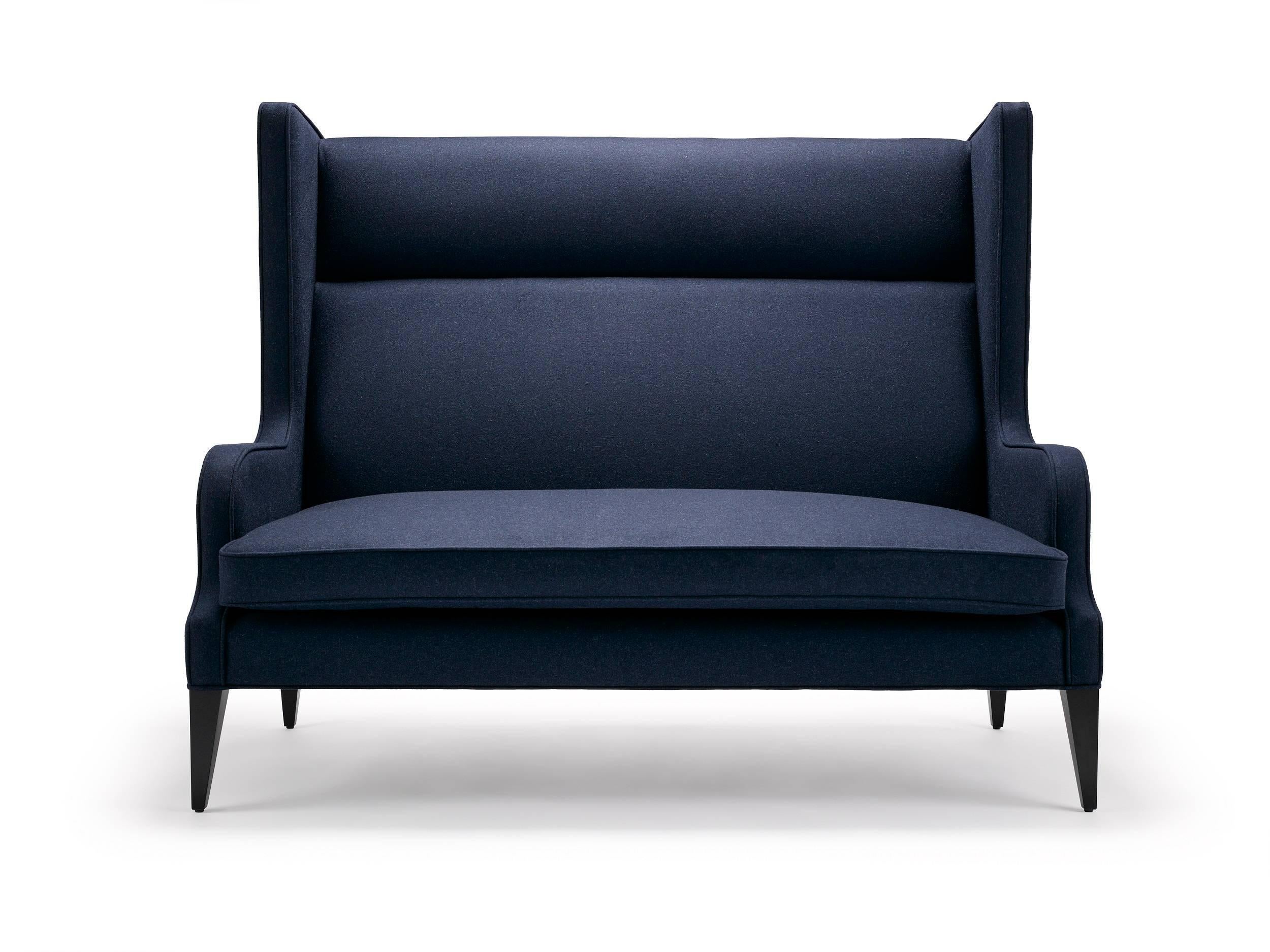 With it's fluid lines and subtle angles, we have the Alae wing sofa. Shown here upholstered in a Navy Casamance Arthur's Seat wool, with legs in black lacquered walnut.

Construction: Solid seasoned beech frame, sprung seat and webbed back with a