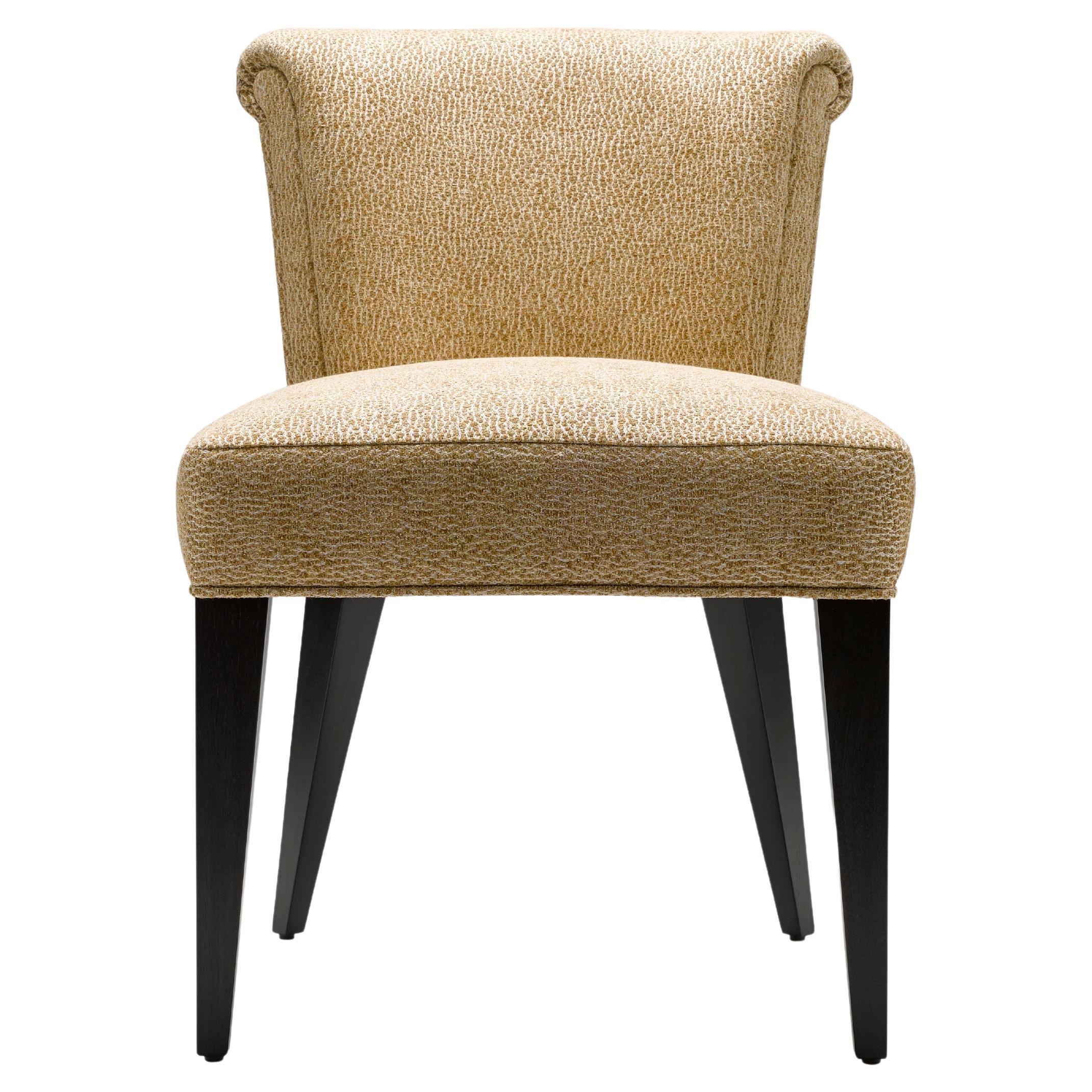 The Eto Dining Chair is a simple, elegant and beautifully detailed dining or occasional chair with a legs made entirely from solid walnut. 

Shown here upholstered in Jim Thompson Galuchat Burnished Gold, with legs in black lacquered walnut. (There