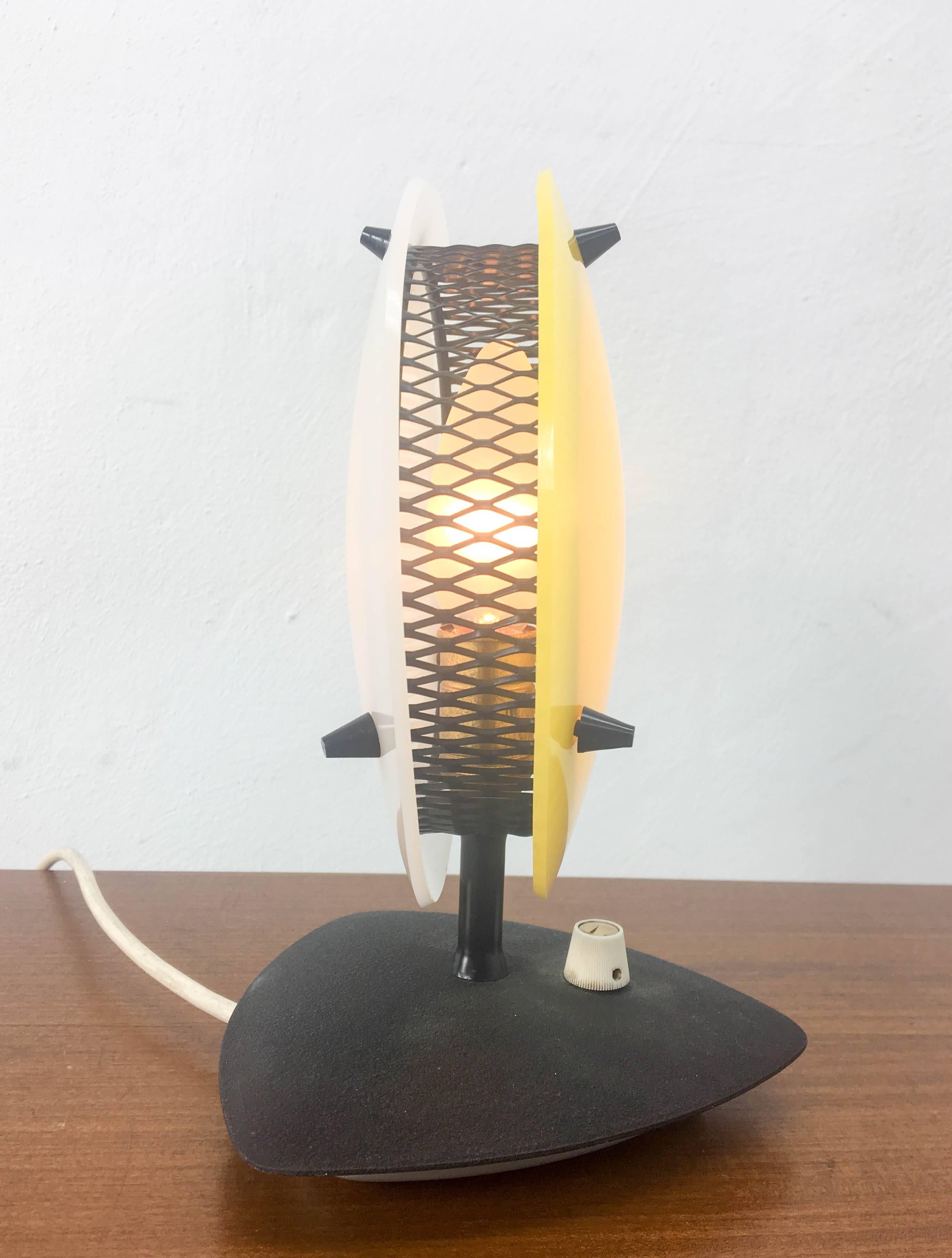 Stylish  1950s Sonnekind  table or desk lamp for Tele Ambiance France 50s.
This lamp features a very early example of a dimmer switch and this particular one is in good working order, as is the rest of the lamp.