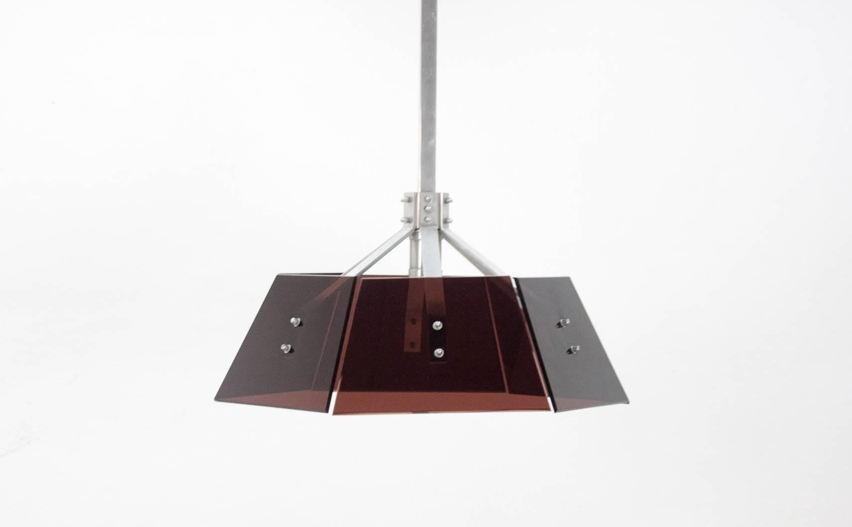 Striking and typically, 1970s pendant light constructed of robust Industrial aluminum hardware and brown perspex panels.