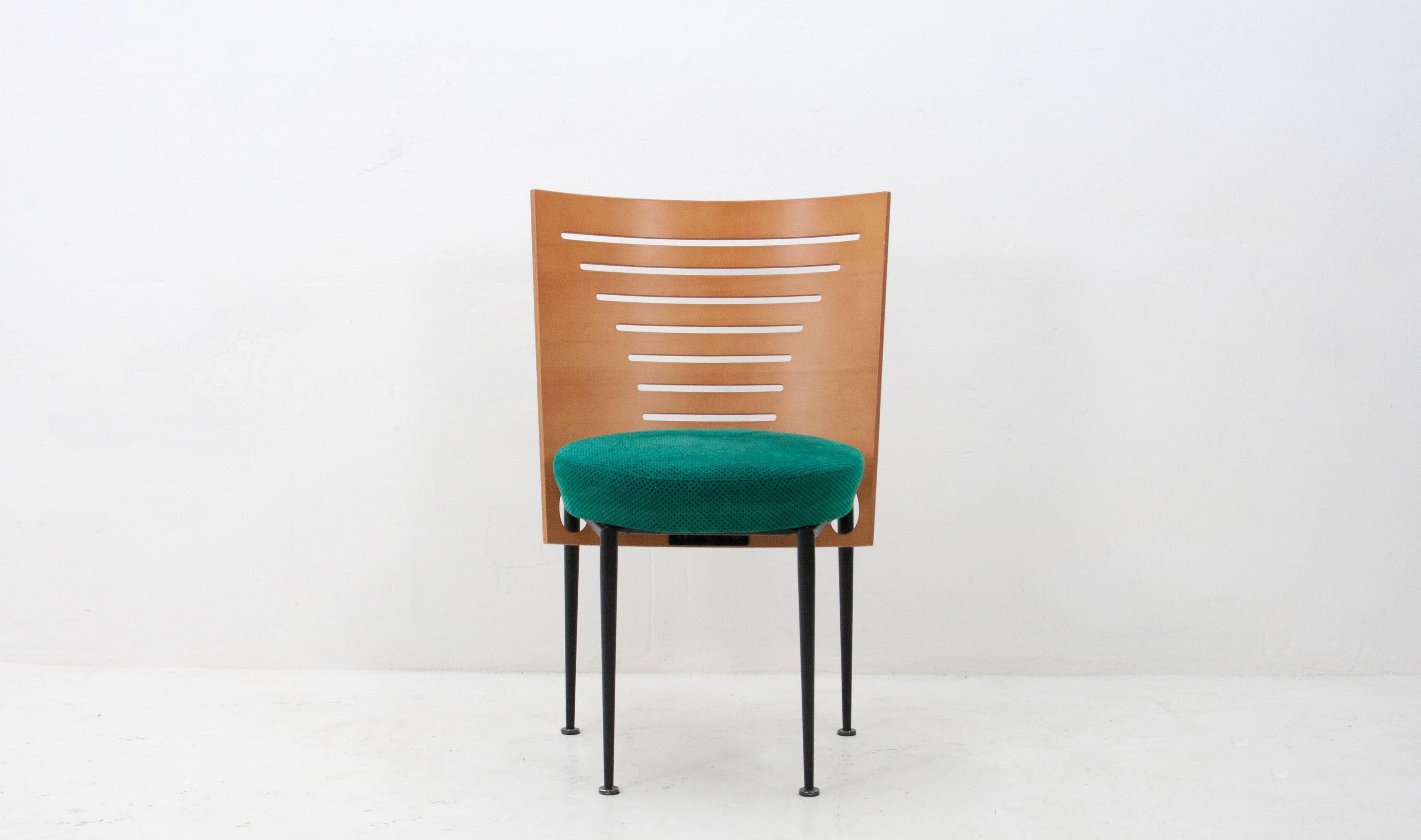 Attractive and well-built designer chair from the 1990s. Very similar in style to Ruud Jan Kokke's designs for Harvink but we've been unable to pin it down. Curved plywood back, steel frame and a very 1990s green fabric seat.