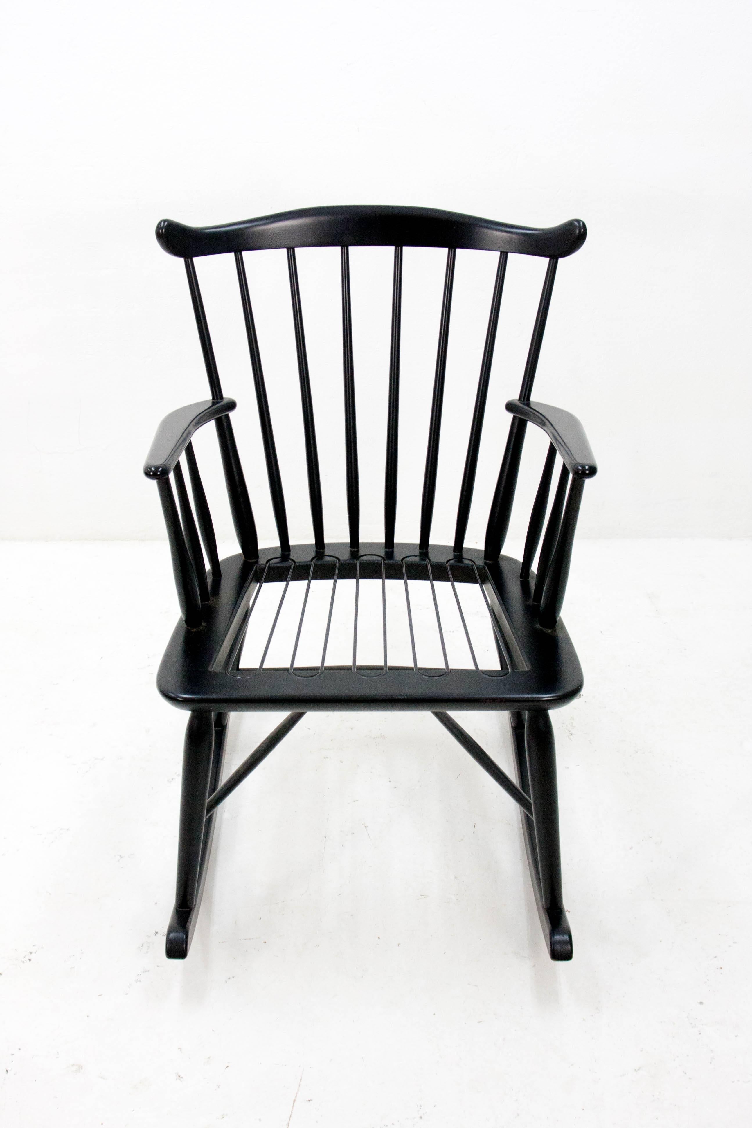 1950s Danish rocking chair designed by Borge Mogensen for FDB Møbler. Solid beech frame in black painted finish. This rocking chair is in very nice sturdy condition and includes the original seat cushion.