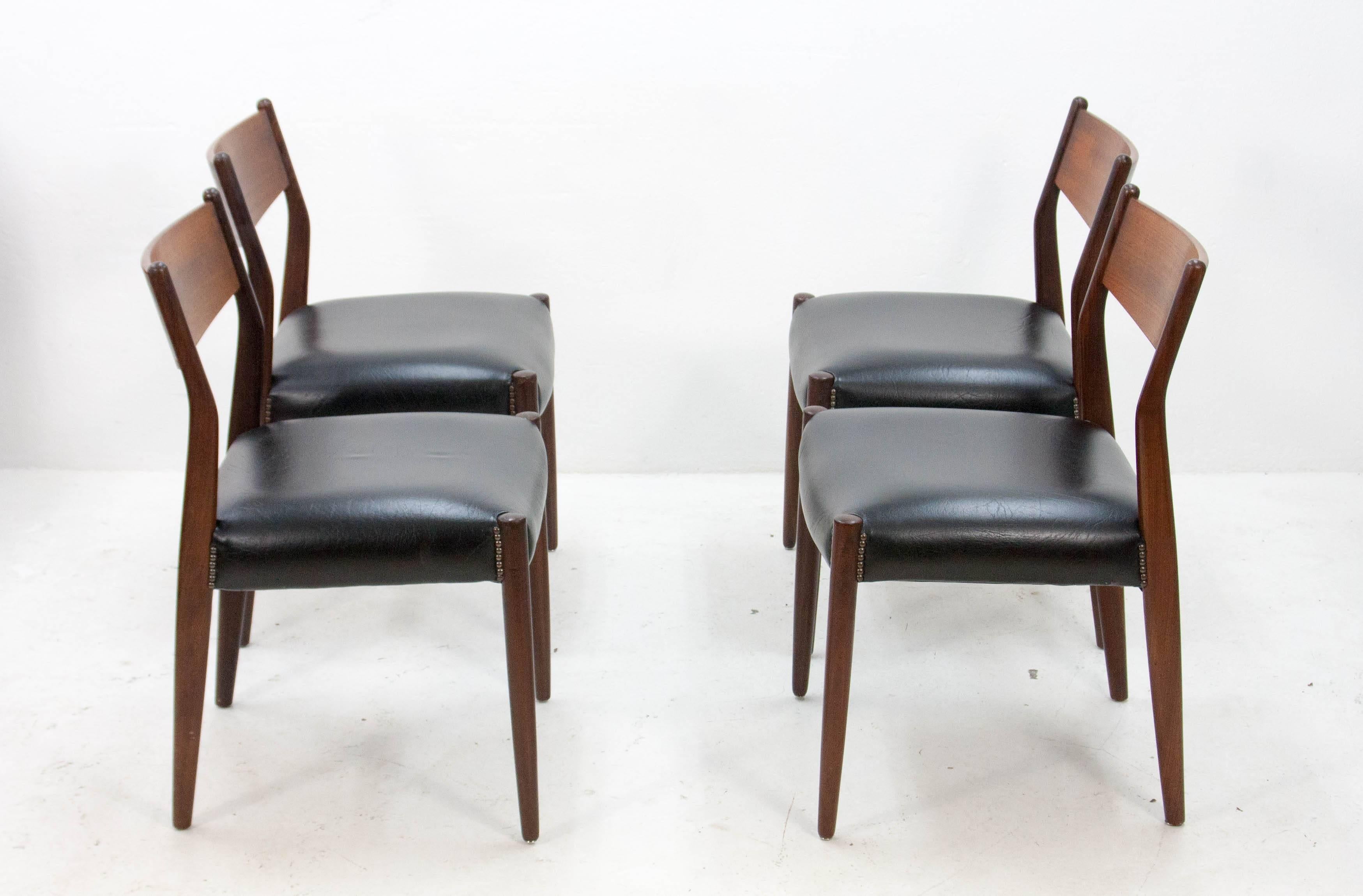 Four stylish Fritho Franeker dining chairs  Teak frame and faux leather upholstery. We have four in very good condition 