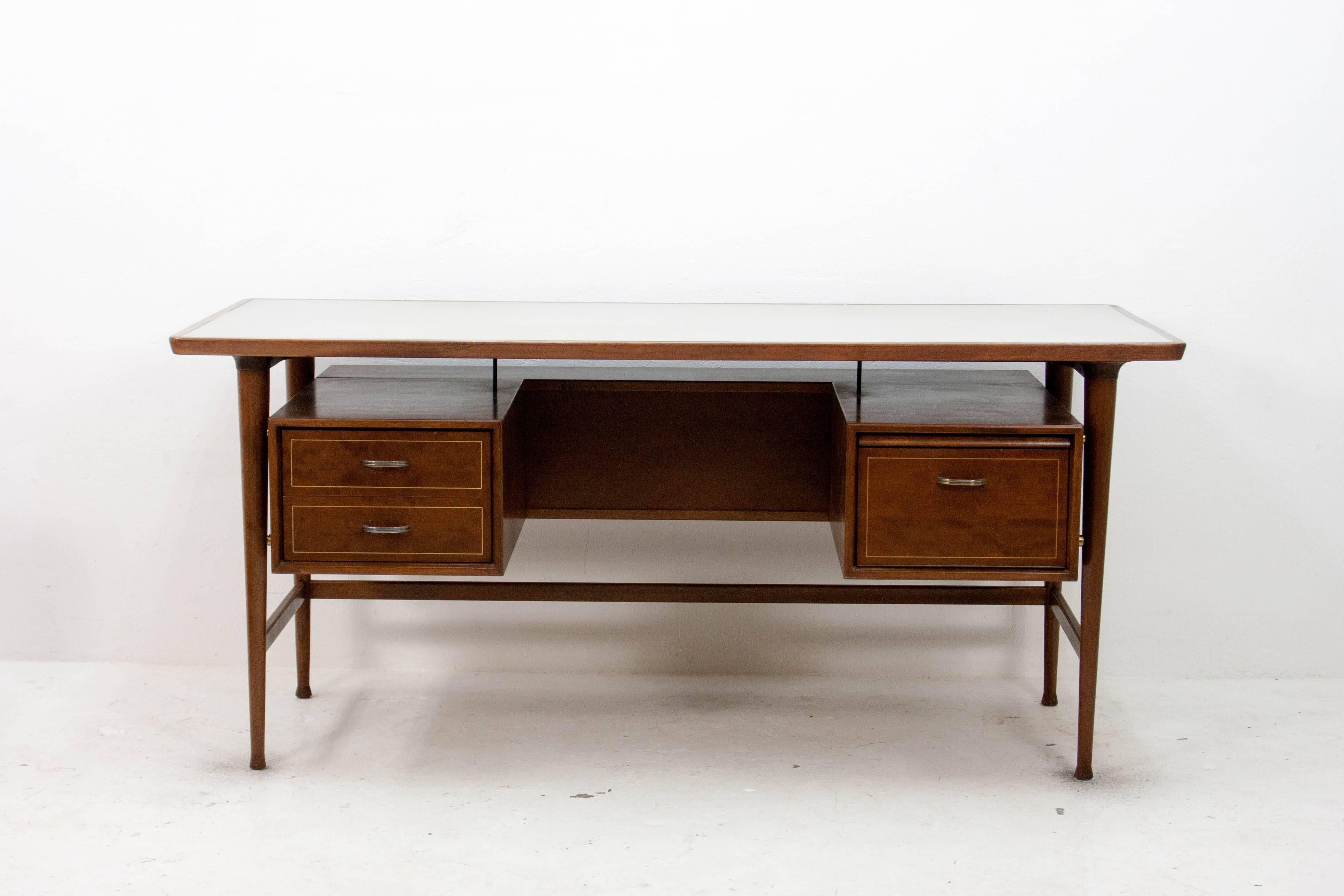 Impressive executive desk from the Kempkes company under their Formule Meubelen ('FM') brand. Produced in the 1960s this desk features a floating storage segment with a shelf on the reverse making it an attractive option for freestanding use in the