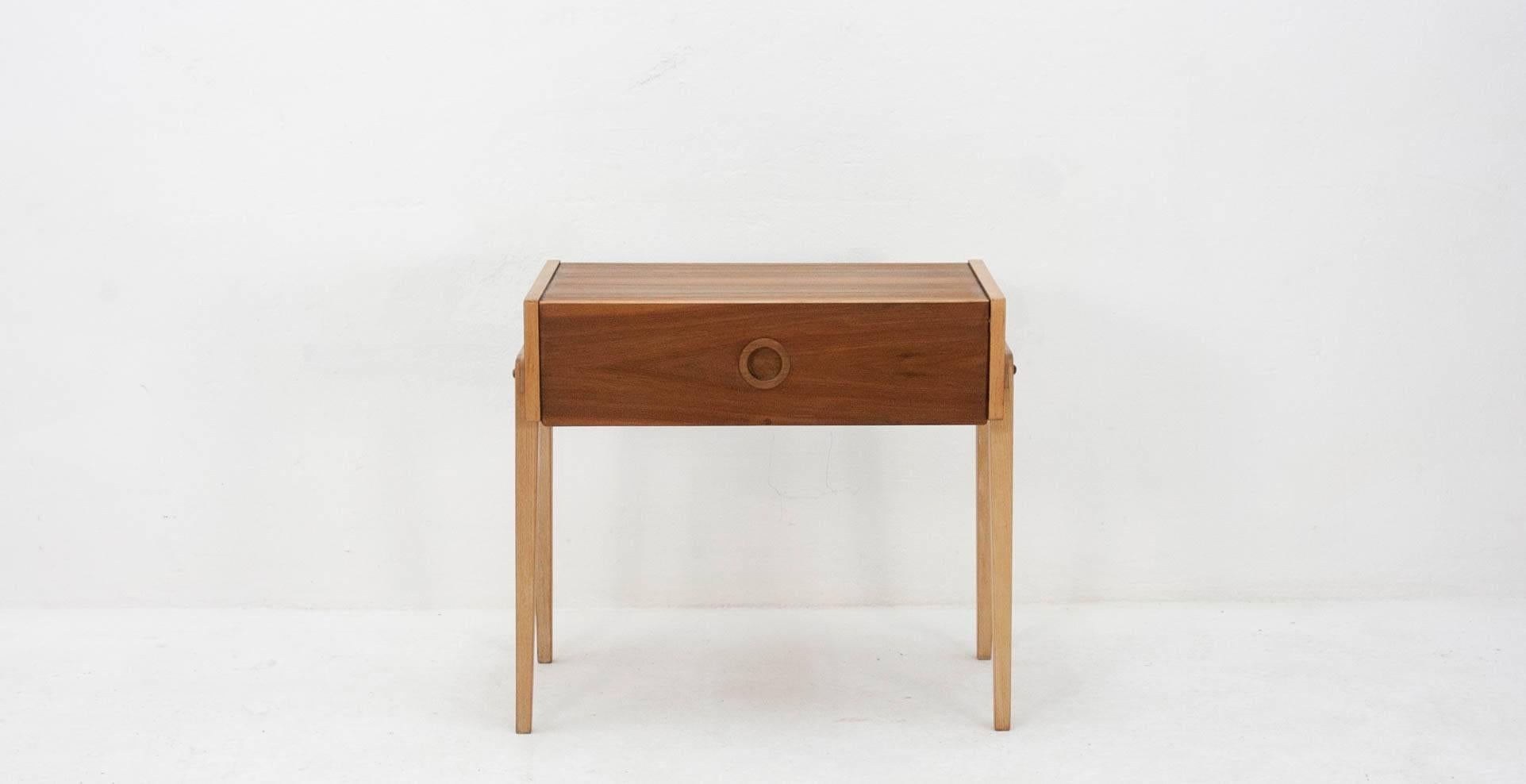 Quirky little sideboard with a fold-down front and a nicely grained top surface.