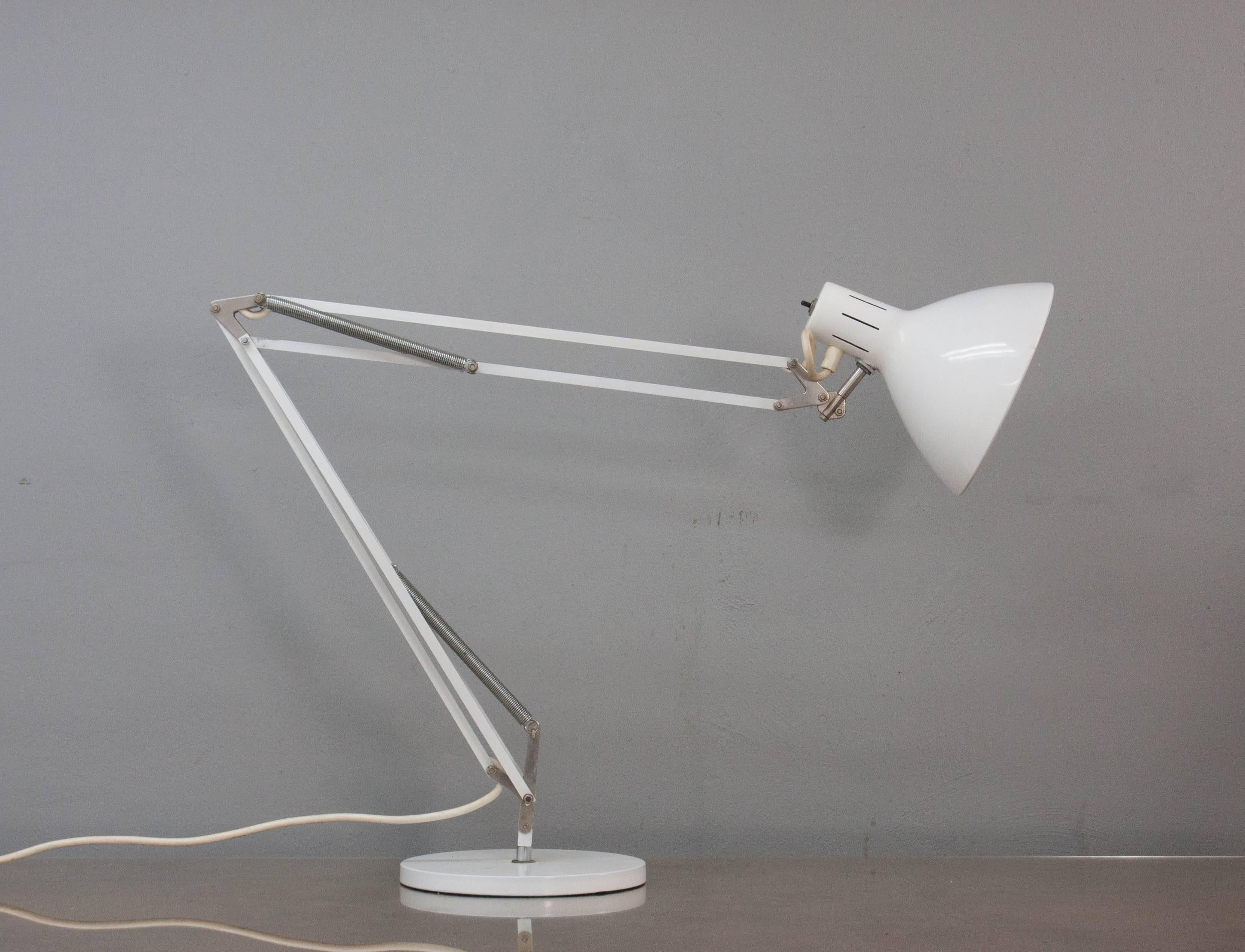 Large midcentury industrial desk lamp designed by H. Th. J. A. Busquet for Dutch lighting specialists Hala Zeist. White lacquered metal on a weighted base.