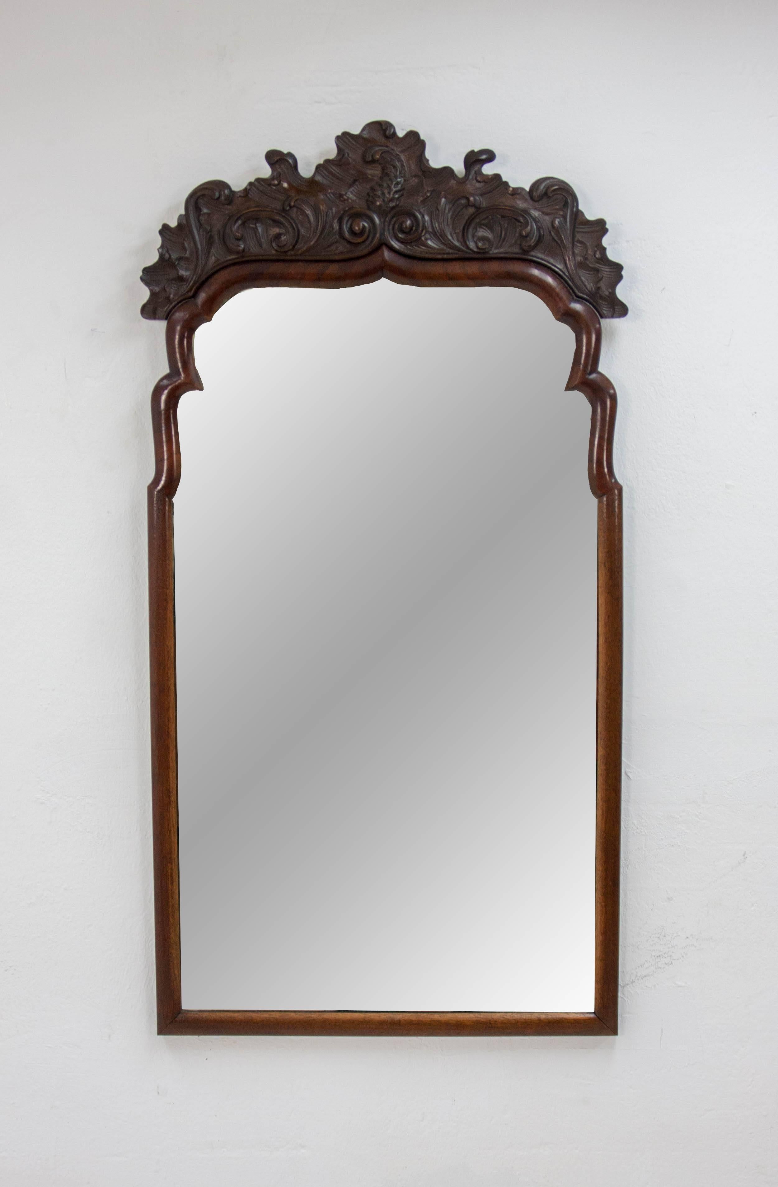Mahogany Biedermeier mirror. 1840-1860. Comes with a detachable decorative piece produced later on (1930s) and most likely Indonesian in origin.