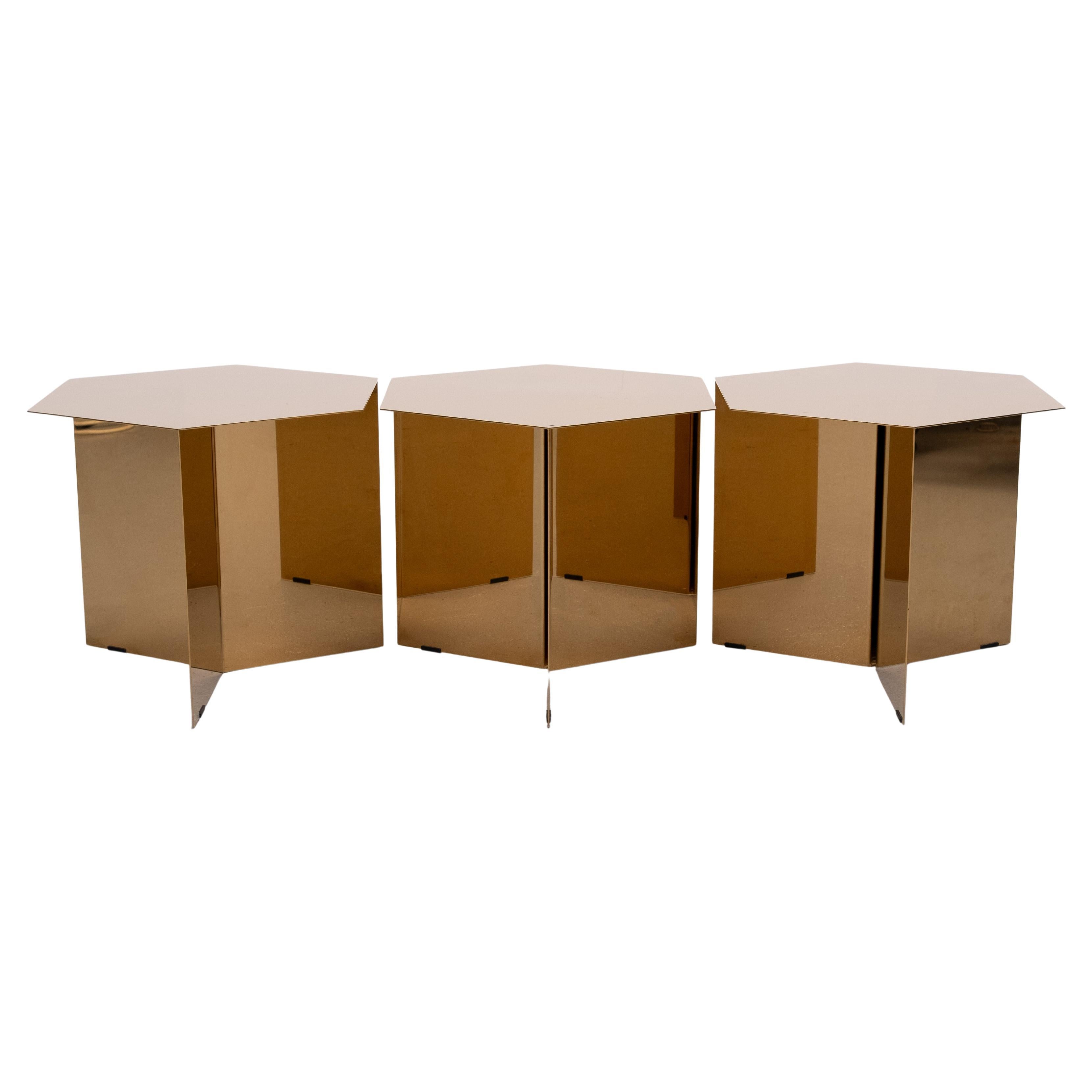 HAY's Slit Table is a geometric Brass side table inspired by paper origami techniques. The slender frame appears to be folded under the tabletop, creating a simple yet sculptural form reminiscent of traditional Japanese paper art.  Compact and