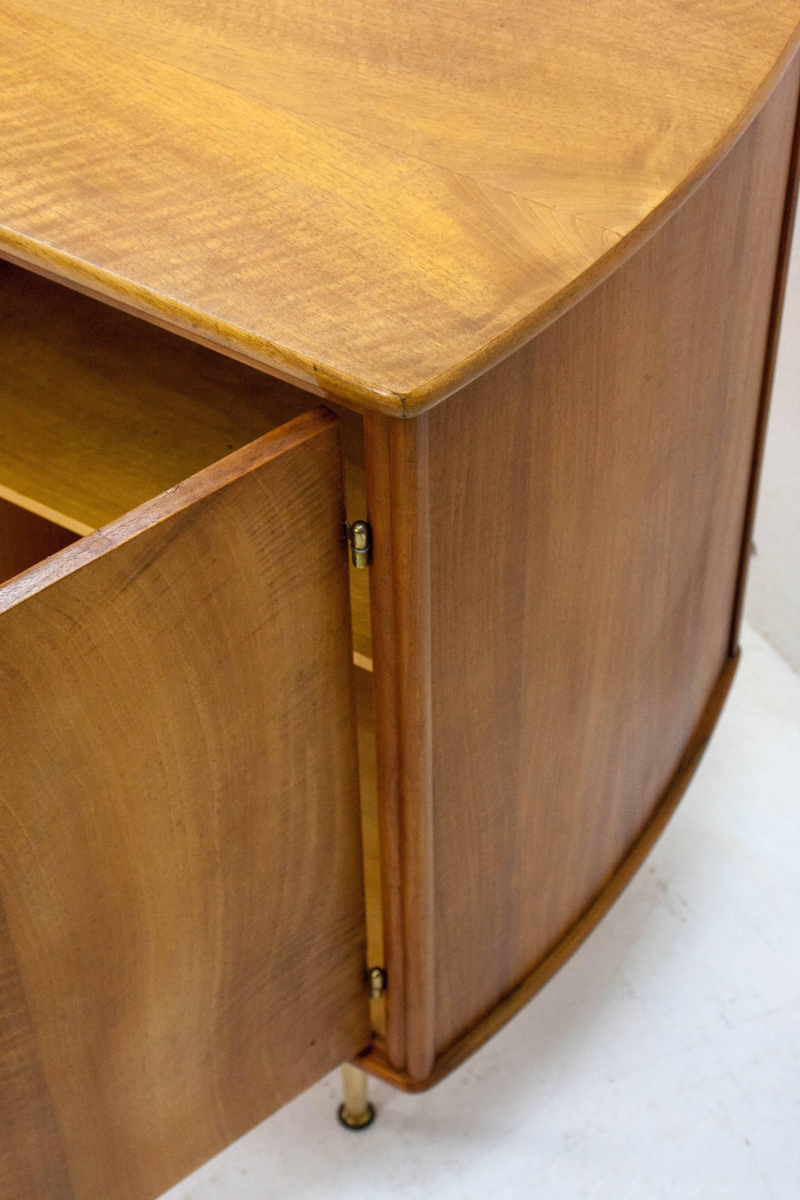 Very nice walnut cabinet designed by William Watting for Dutch manufacturer Fristho Franeker in the 1960s. Note the gentle curve to the sides.