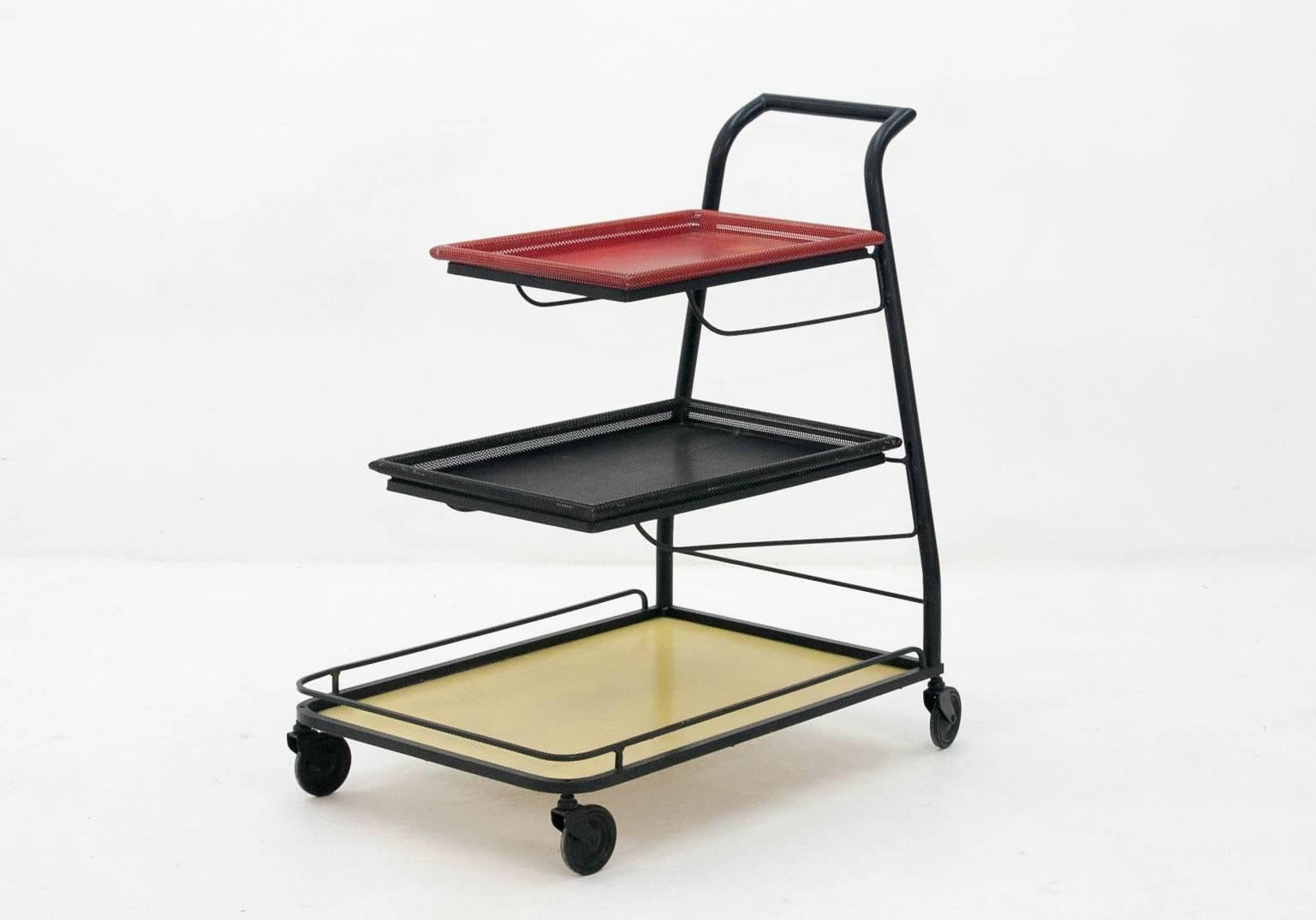 Iconic  and rare Mathieu Matégot  DEMON serving trolley or bar cart. Produced by Artimeta Soest in the 1950s and finished in a striking red/black/yellow color combination. Original colors . A real design by the great Designer . The last photo
is