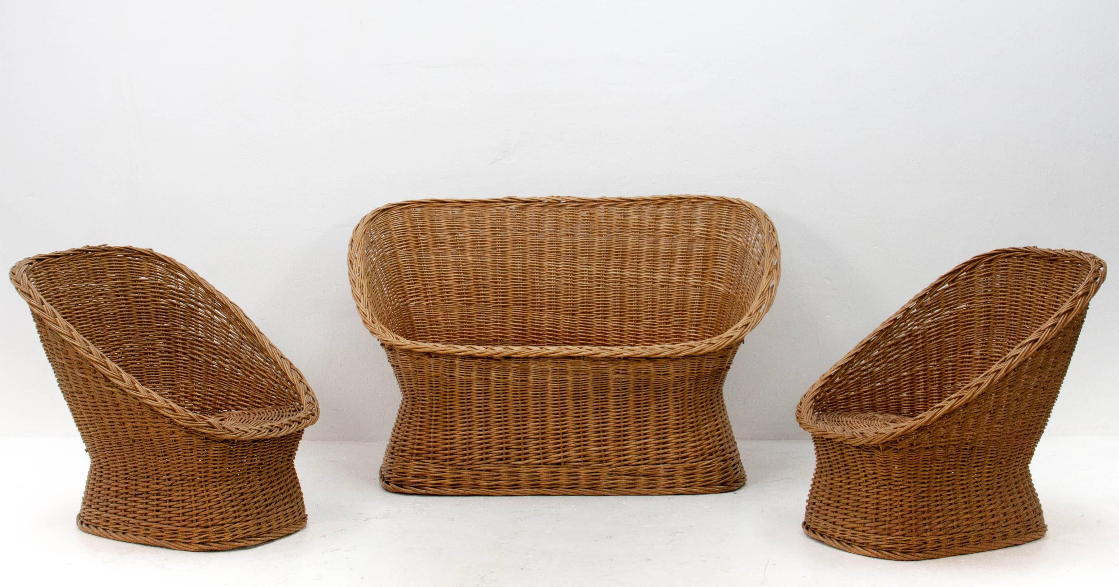 Pair of vintage rattan lounge chairs and a matching love seat from the specialists Gebroeders Jonkers ('Jonkers Brothers'). Very nice condition.