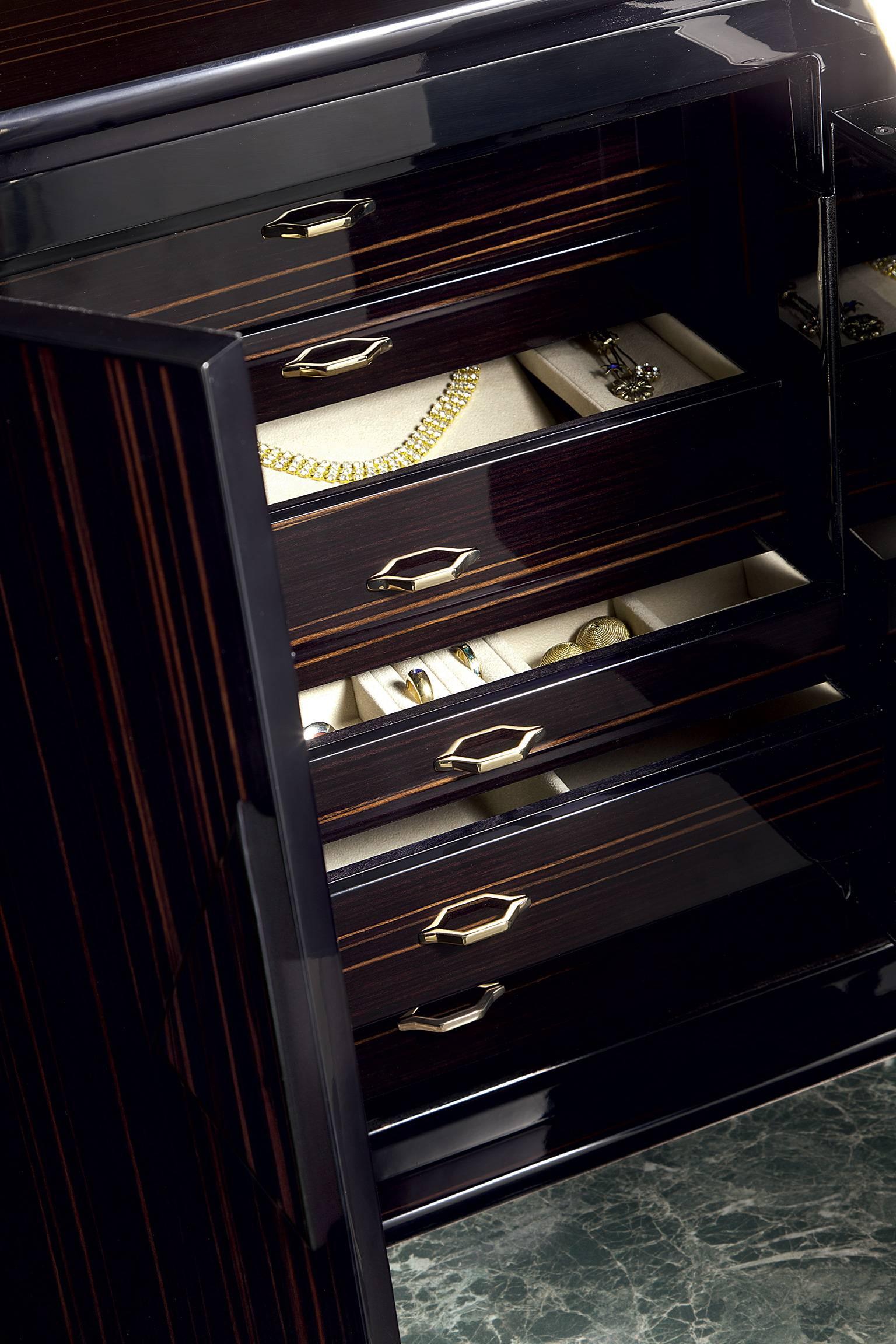 The Agresti Nero Forziere chest safe is made of polished ebony with Grade 2 safe. 
It contains six drawers which are lined to store all sorts of jewels and has a necklace bar. Brass-plated, 24-karat gold accessories. Unique features of this