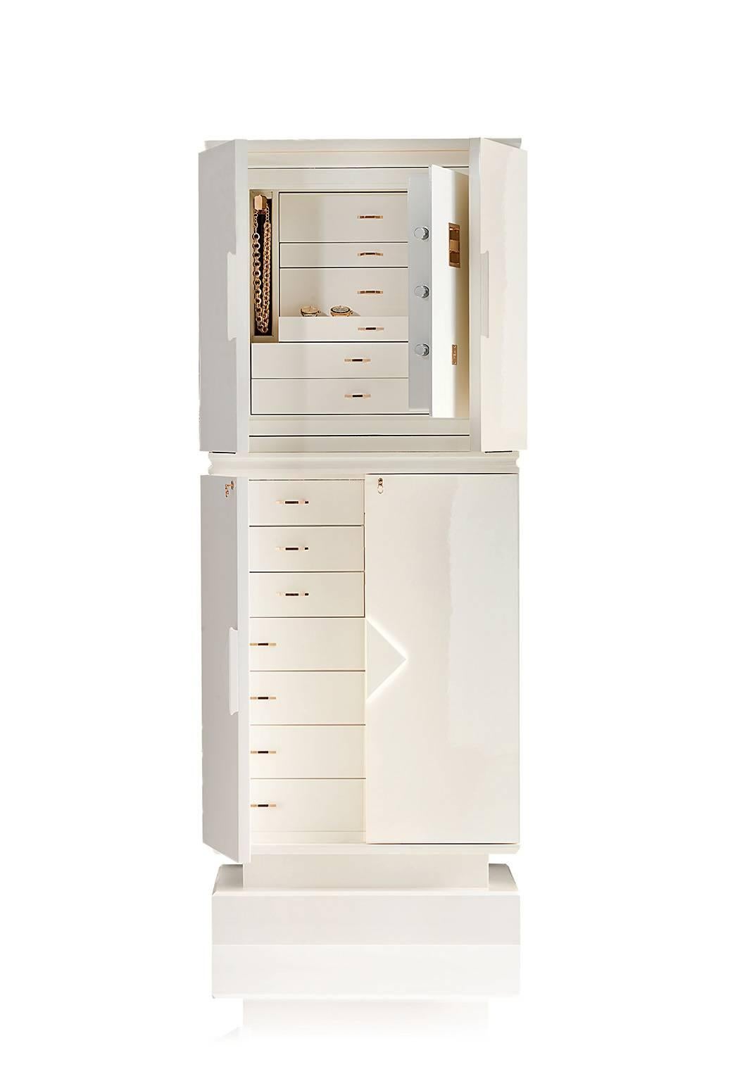 Magia Bianca is a contemporary armored jewelry armoire safe in white, polished, Bird's eye Maple. Pull-out necklace bar. Brass, 24-karat gold-plated accessories. Inside of safe is shiny white.
Made in Florence, Italy by Agresti since 1949.
 