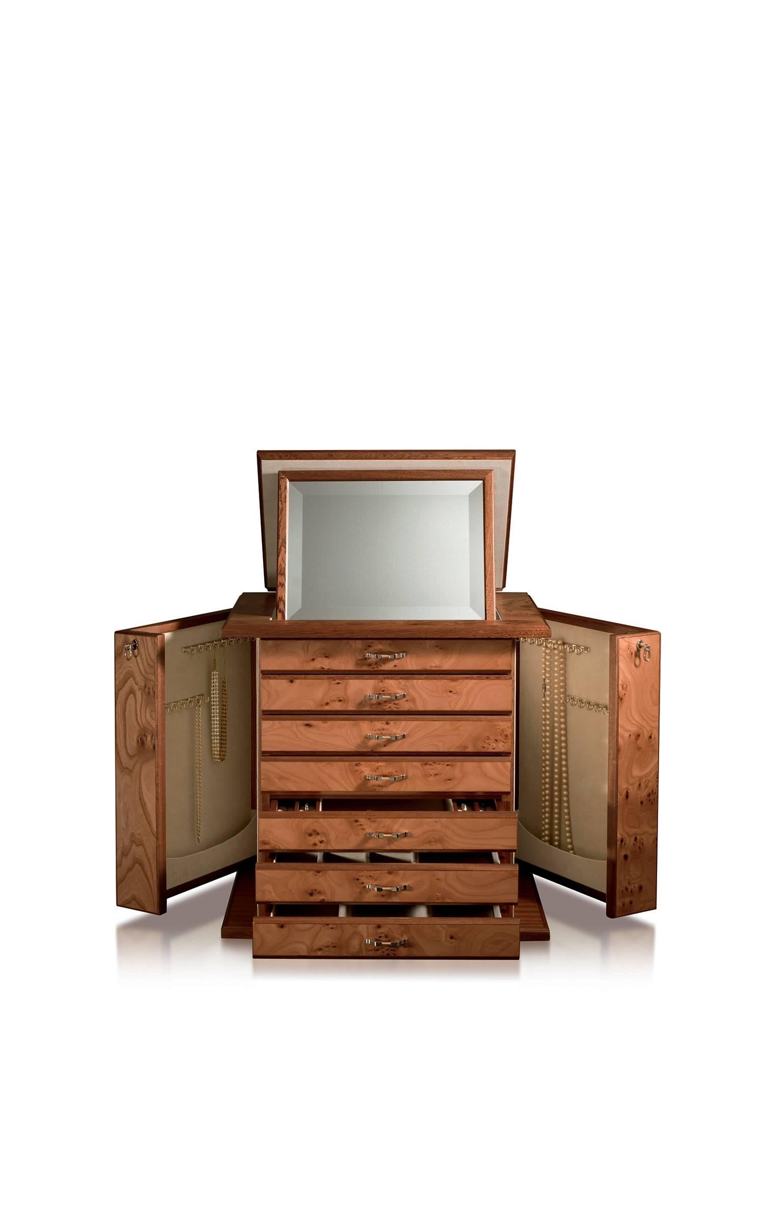 Jewelry chest in elm briar and mahogany, matte finish, ultrasuede lining. 24-karats gold plated brass accessories, with necklace bars, lockable doors and six drawers. Adjustable mirror on top part.