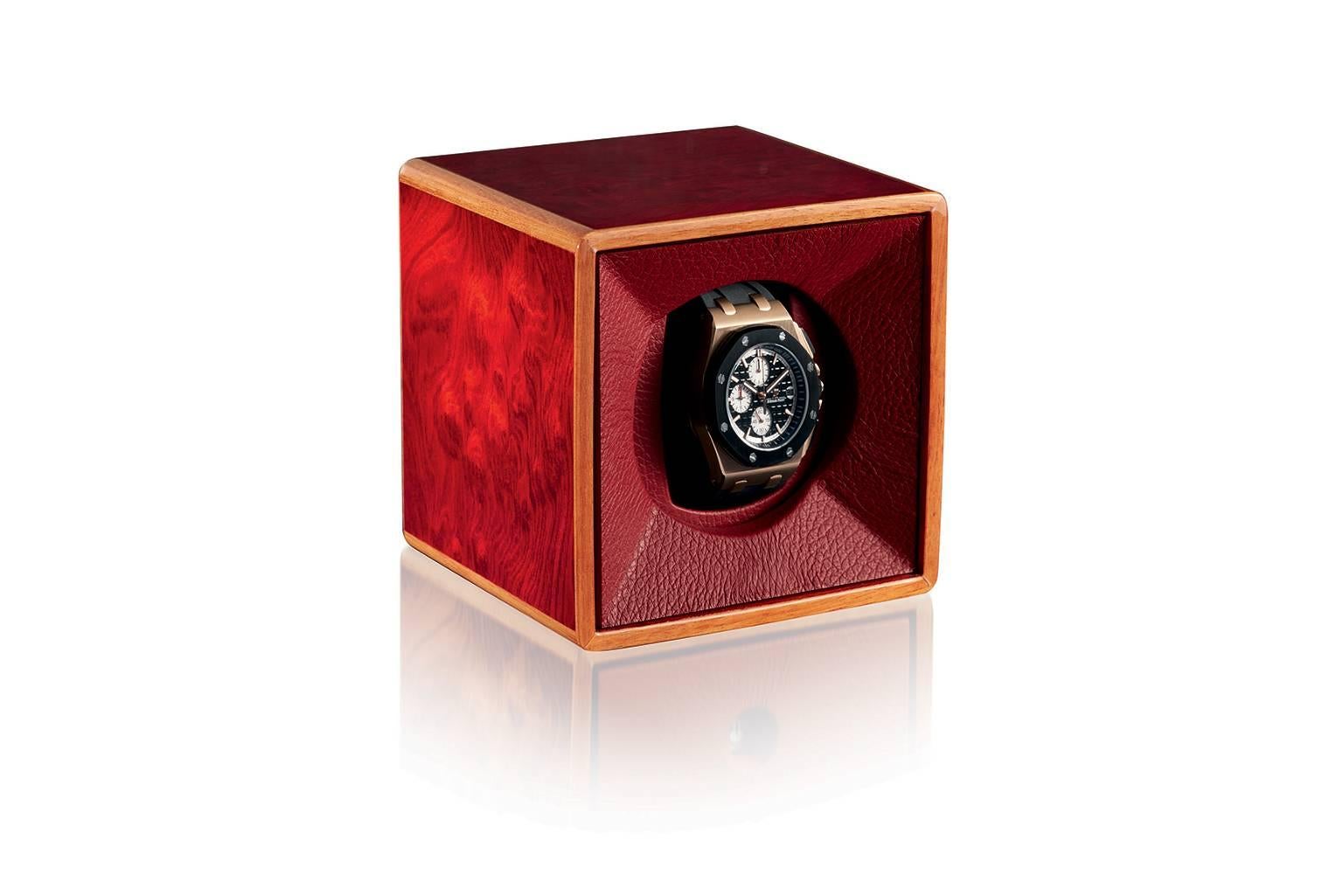 Watchwinder in polished red briar for automatic watch. Leather lined. Winder made in Switzerland, battery operated.