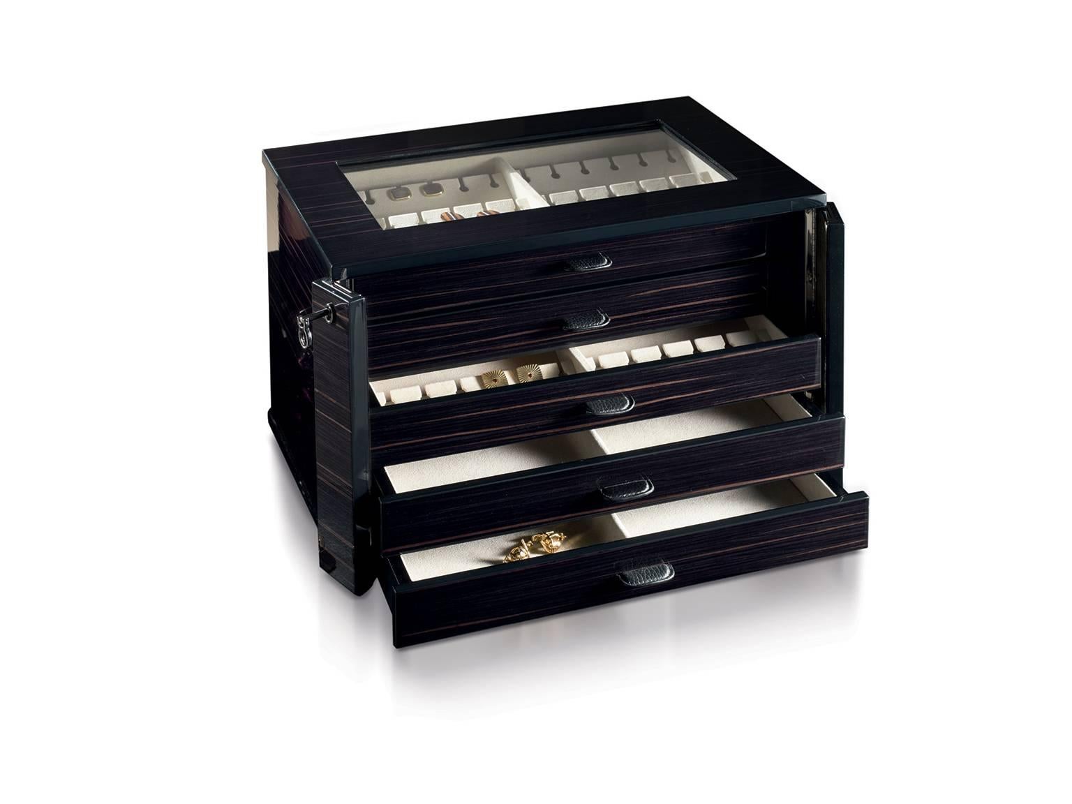 Chest in polished Ebony, lockable, for 54 pairs of cufflinks, extendable to 90 pairs.