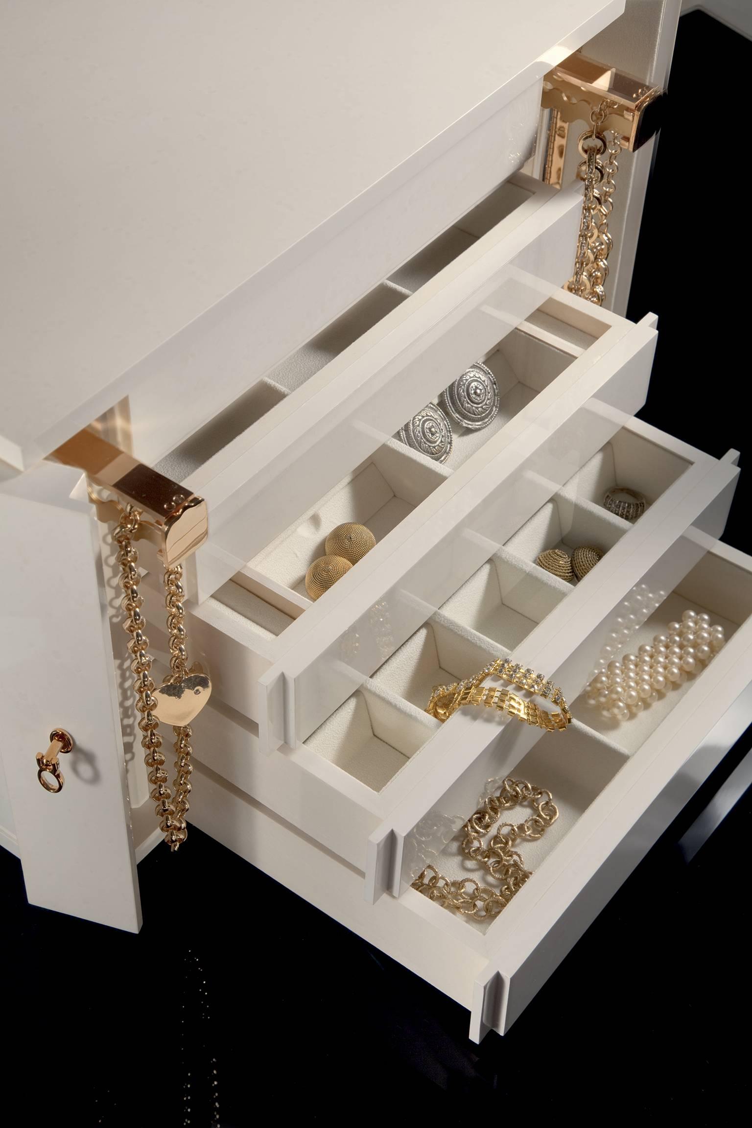 Shiny white bird's-eye Maple shiny jewel chest with 24-Karats pink gold-plated hardware. Two necklace bars. The two doors lock the whole chest.