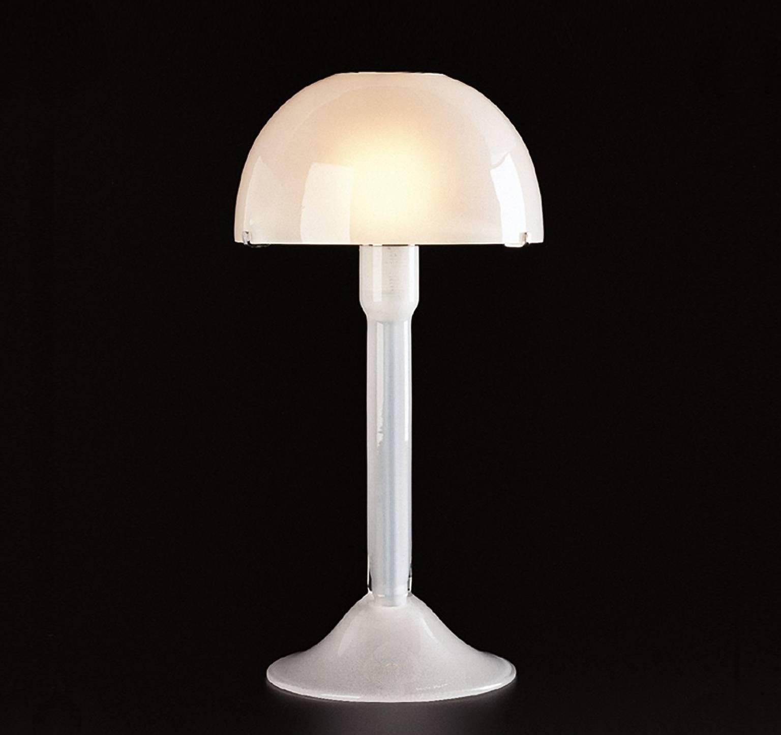 Table lamp of milk white mouth blown Murano glass designed in 1992 by Carlo Moretti. 

60 watt incandescent bulb, 42 watt ecolamp socket E27.


Carlo Moretti: An artisan factory

Strolling afoot through the foundations of Murano, the visitor