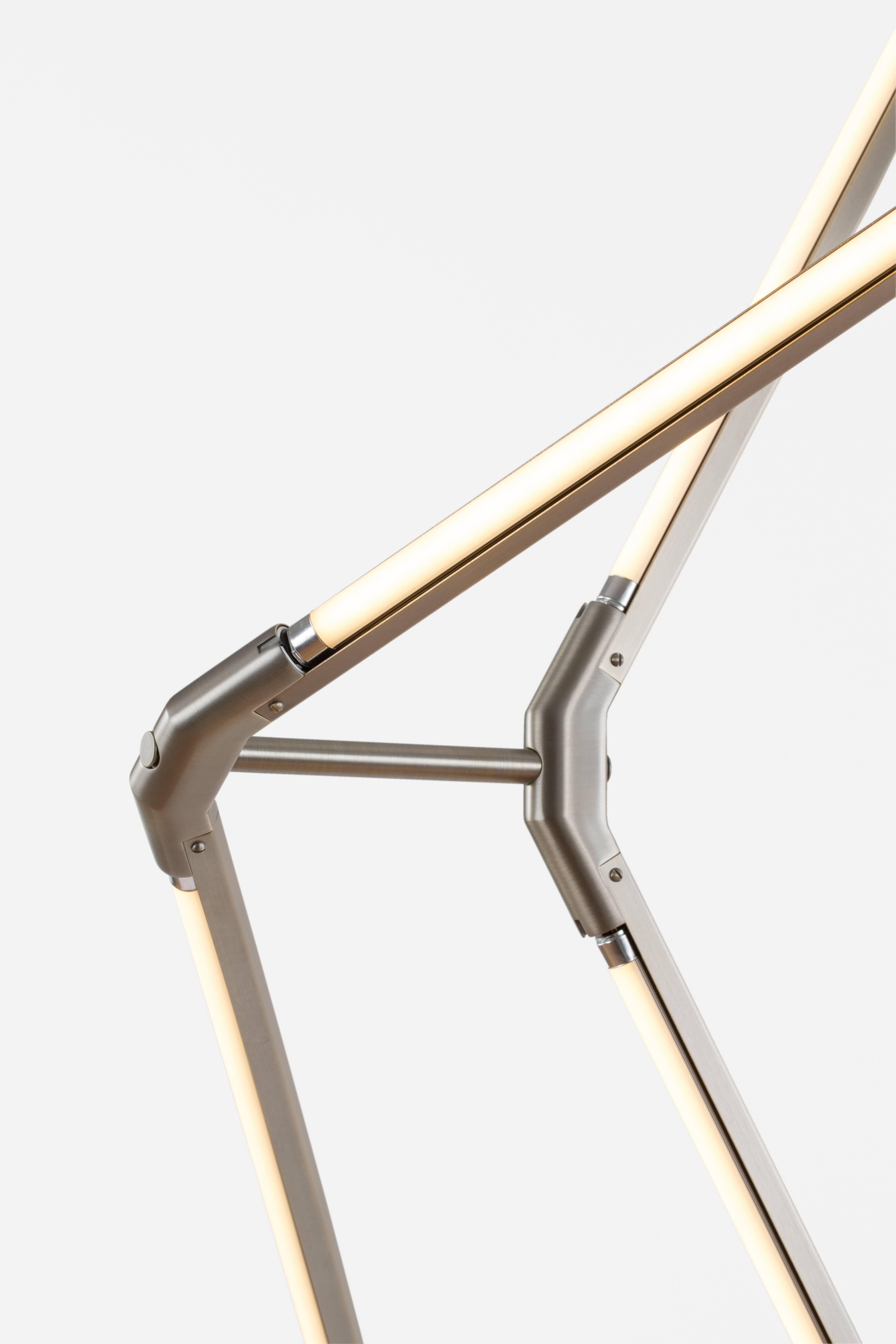 Zelda juxtaposes the powerful materiality of brass-encased LED tubing with gracefully suspending planar forms. This light comes in multiple shapes, sizes, and configurations, and seamlessly adapts to a vast array of spaces and sensibilities. Zelda's