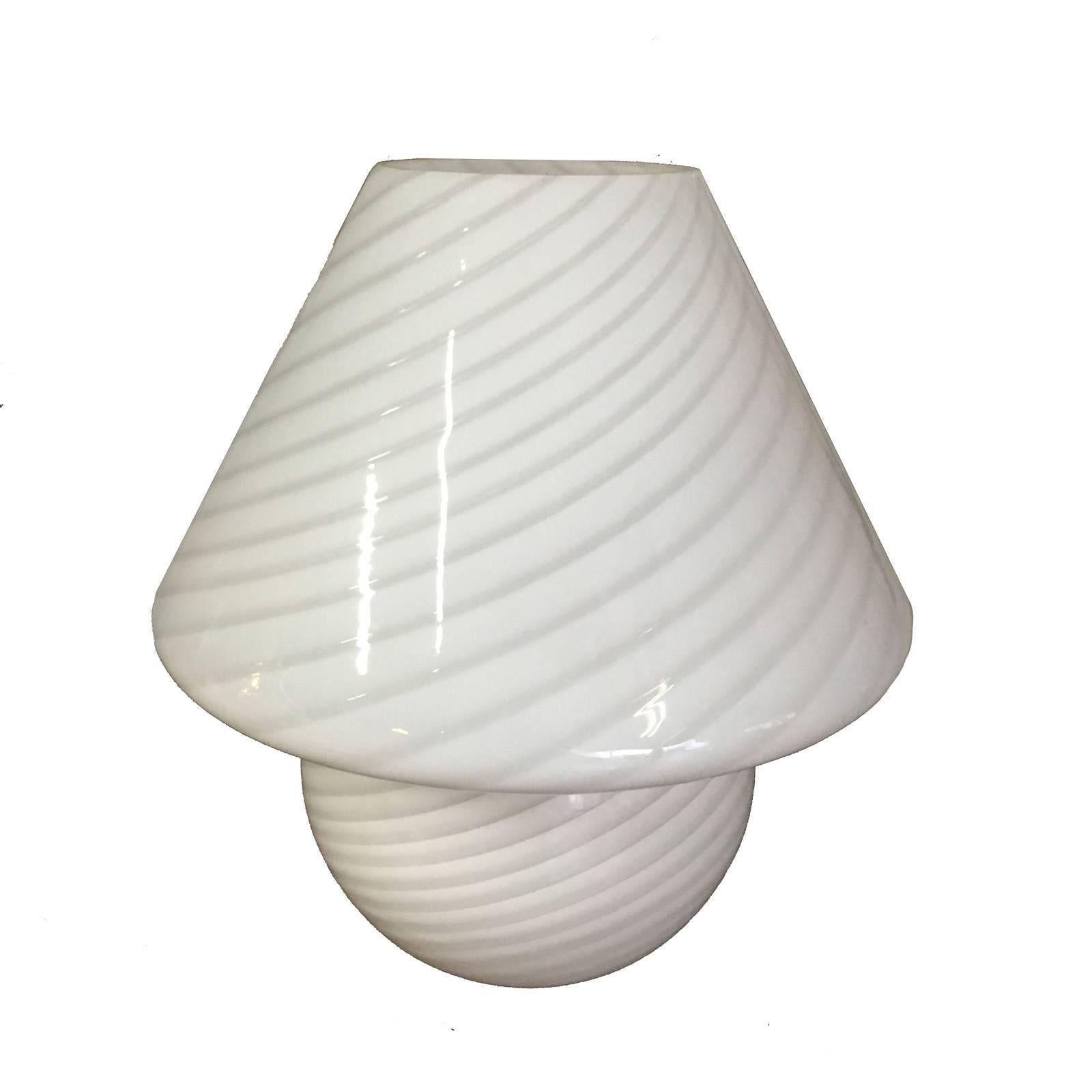 Unique swirled Murano glass lamp in mushroom form by Vetri.

A beautiful and very rare design, creating beautiful warmth in any space. A gorgeous example of 1970s design made from the highest quality Italian Murano glass,.