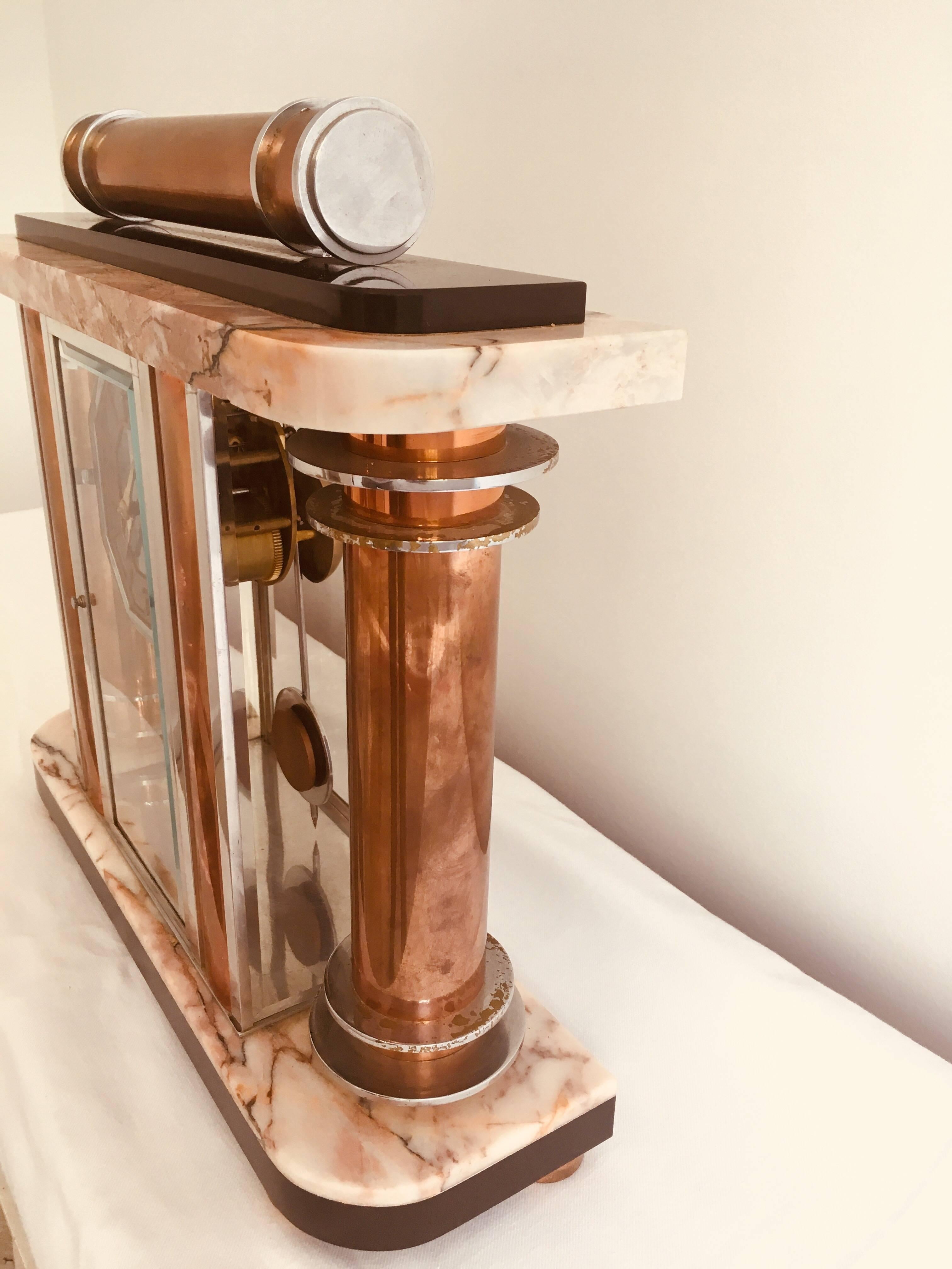 French Art Deco F. Martin marble mantel clock, 1930s. Nickel chrome and copper combine with butterscotch and black marble to the top and base, to make this an exceptional example by famed French clock maker F. Martin. It is in excellent working