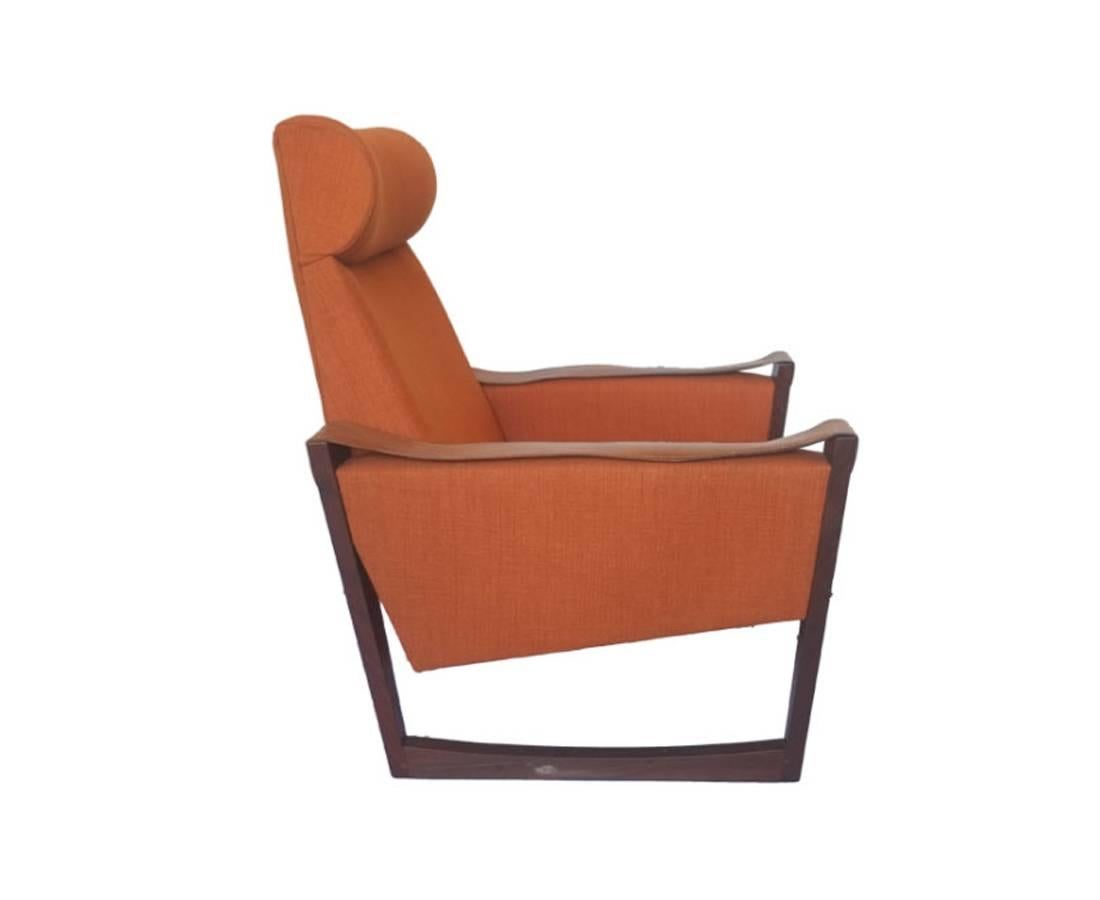 Danish high back armchair, circa 1960s. Maker unknown.

In excellent condition, with leather arm detail. 

A gorgeous example of Mid-Century Scandinavian design, with elegant tapered sleigh leg detail. 

 