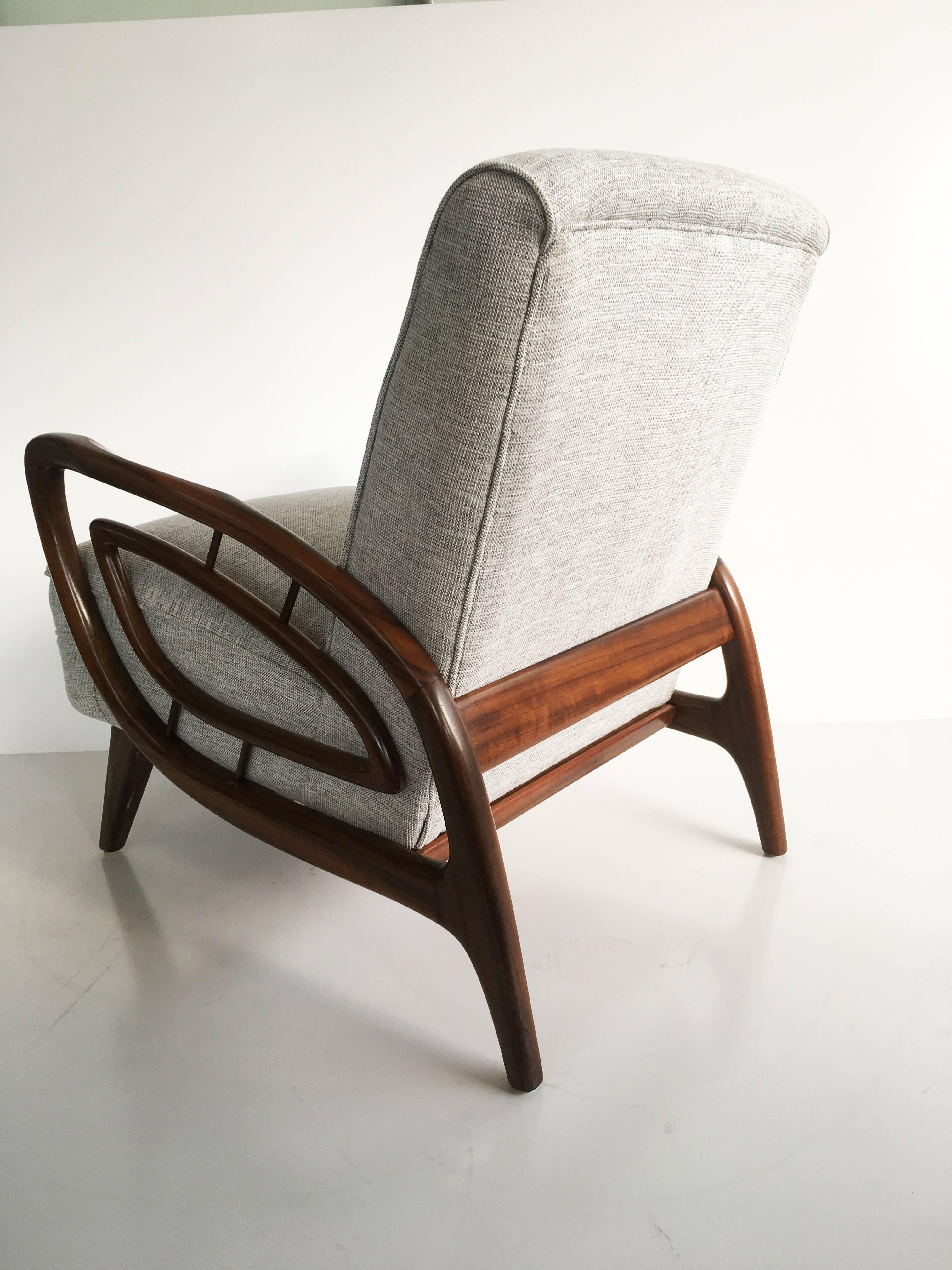 Set of two truly unique Australian Mid-Century armchairs by artisan craftsman Jakob Rudowski, 1960s.

Made of quality Australian walnut with textured grey upholstery. Beautiful sculptural winged arm detail.