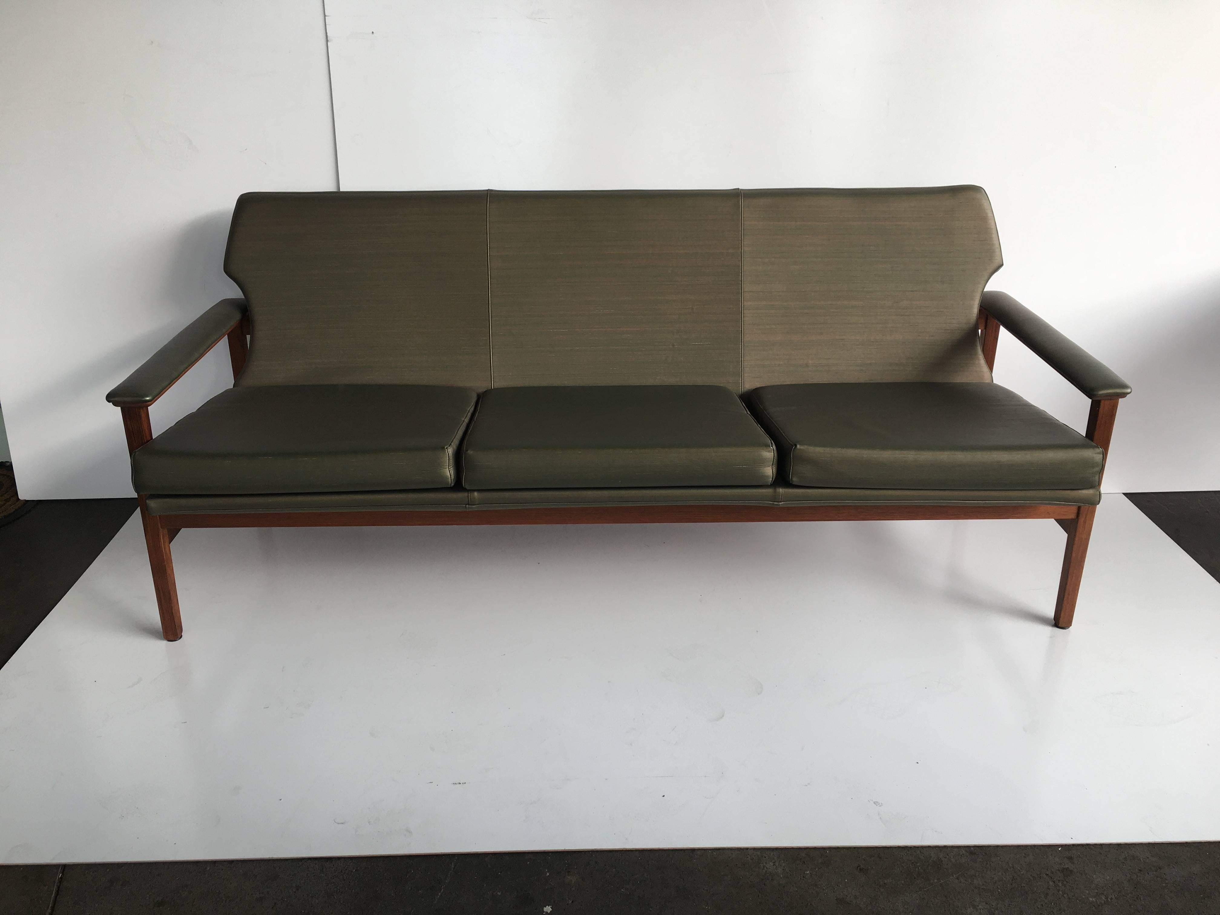 Exceptionally stylish lounge suite by renowned Australian maker TH Brown.

Comprises three-seat and two 