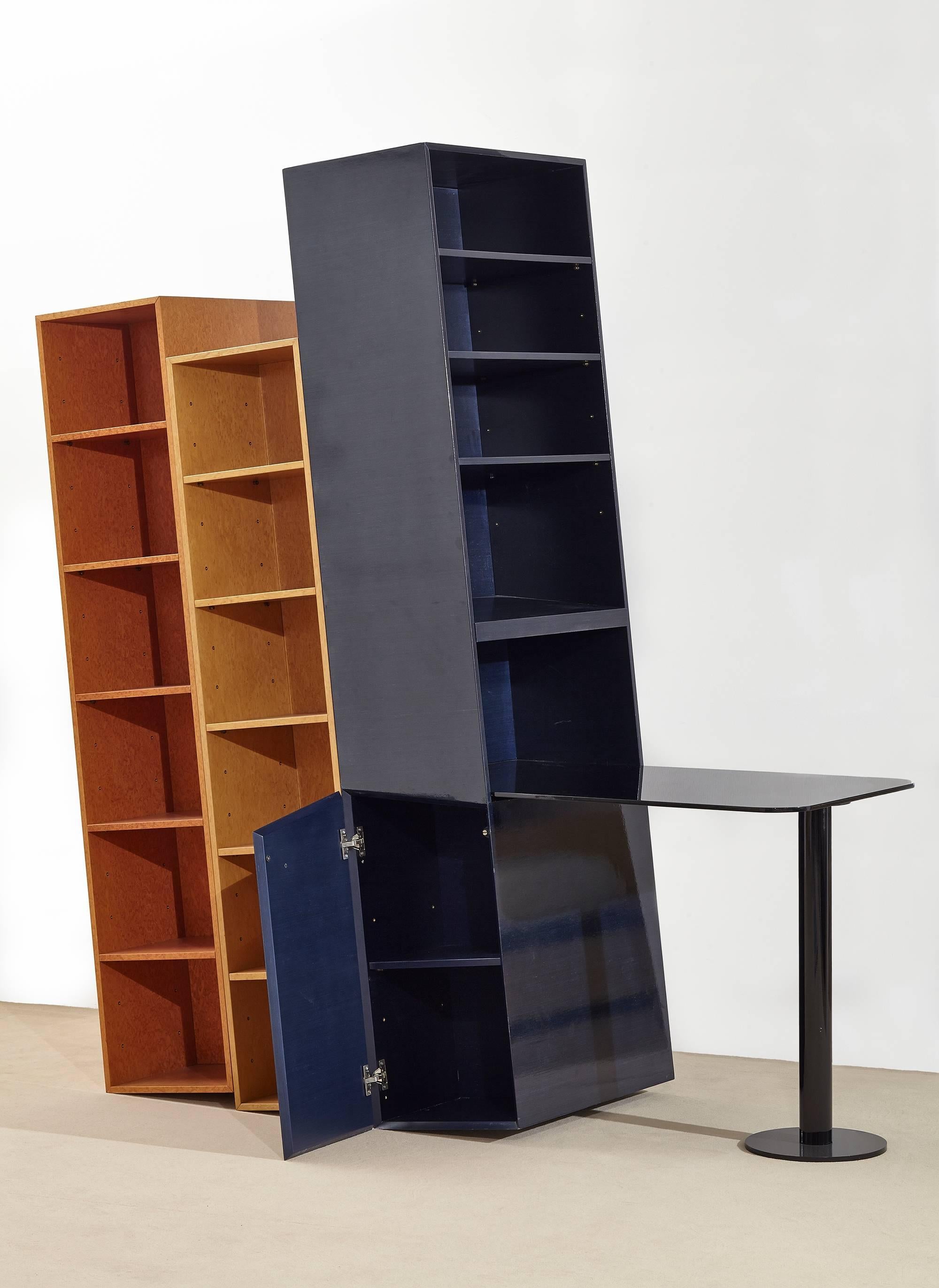 Kampa is a three-piece bookcase with built in table designed by Ettore Sottsass as part of the 