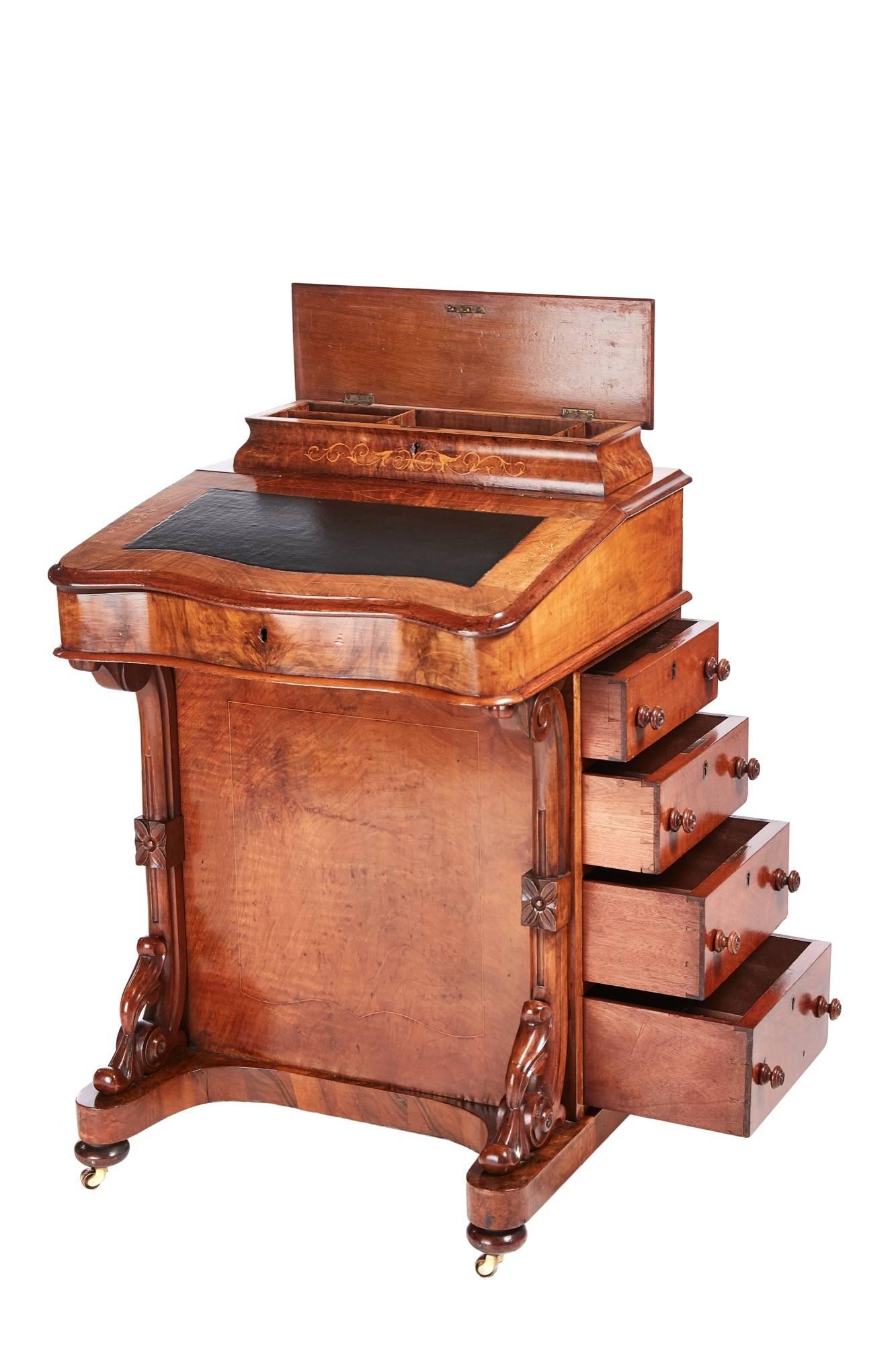 Victorian burr walnut inlaid Davenport, lift up lid with fitted interior, serpentine front, carved supports to the front, the right hand side has four drawers with original knobs, the left side has four false drawers with original knobs, standing on