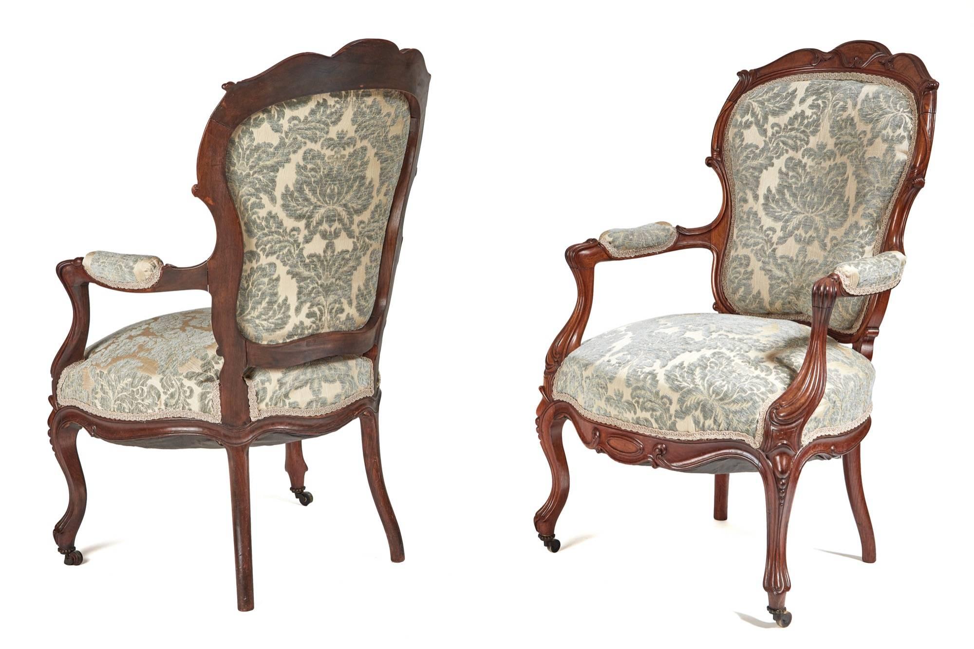 A pair of French rosewood open armchairs, a very rare opportunity to own a matching pair of this quality and condition, lovely shaped back and arms, carvings to the frames, standing on nice cabriole legs to the front outswept back legs, newly