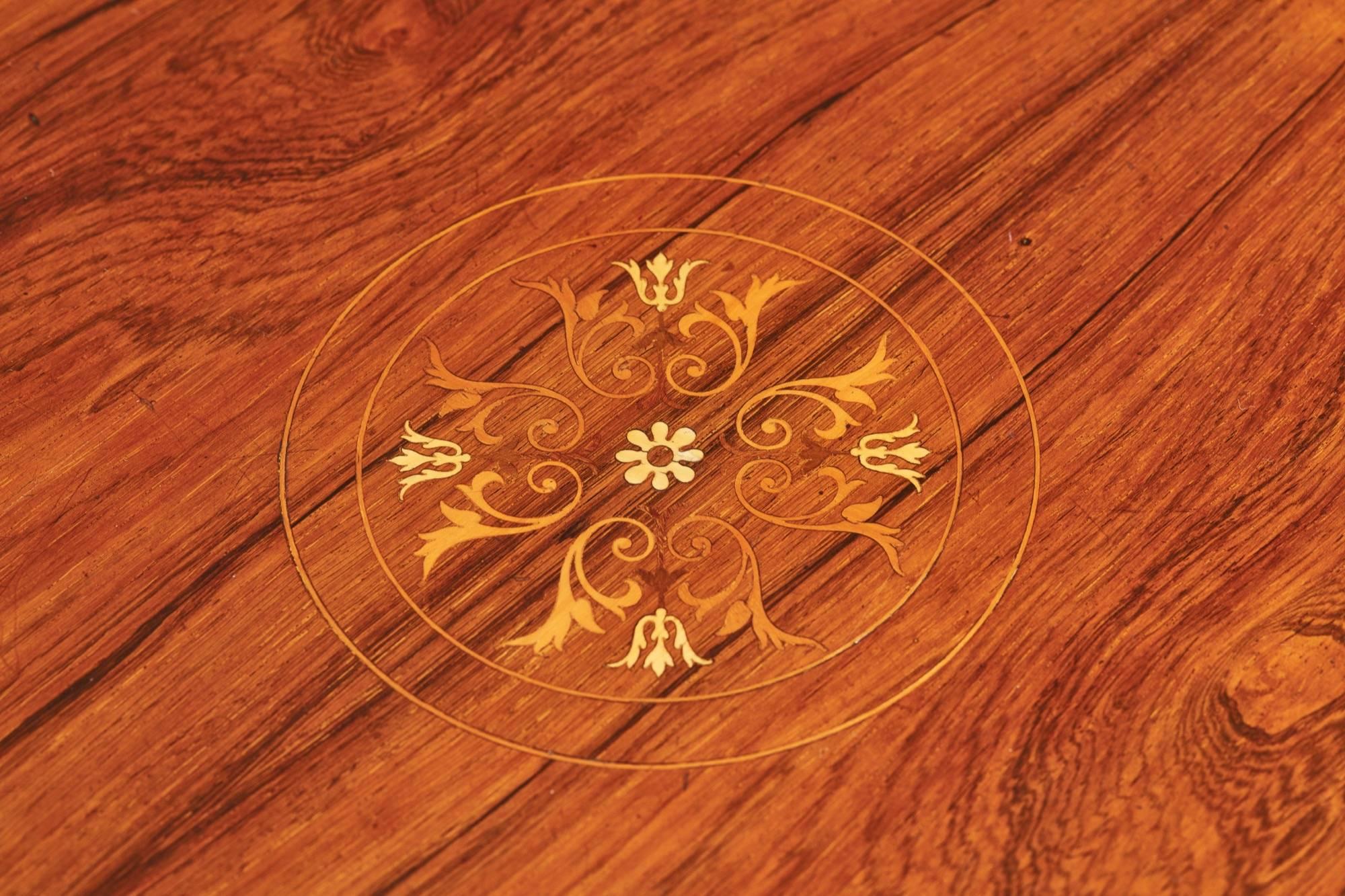 A rosewood inlaid centre table, with marquetry centre floral inlay, marquetry inlaid boxwood banding, inlaid frieze supported by four inlaid square tapering legs terminating in spade feet

Good colour and condition.