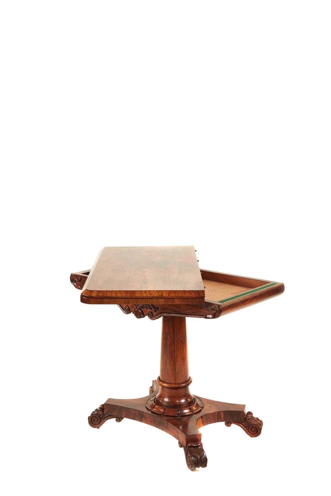 William IV rosewood card table, with a lovely figured rosewood top that lifts and swivels to reveal a green baize interior, nice carved frieze supported by a turned rosewood pedestal with a carved collar finishing on a quatrefoil base with scroll