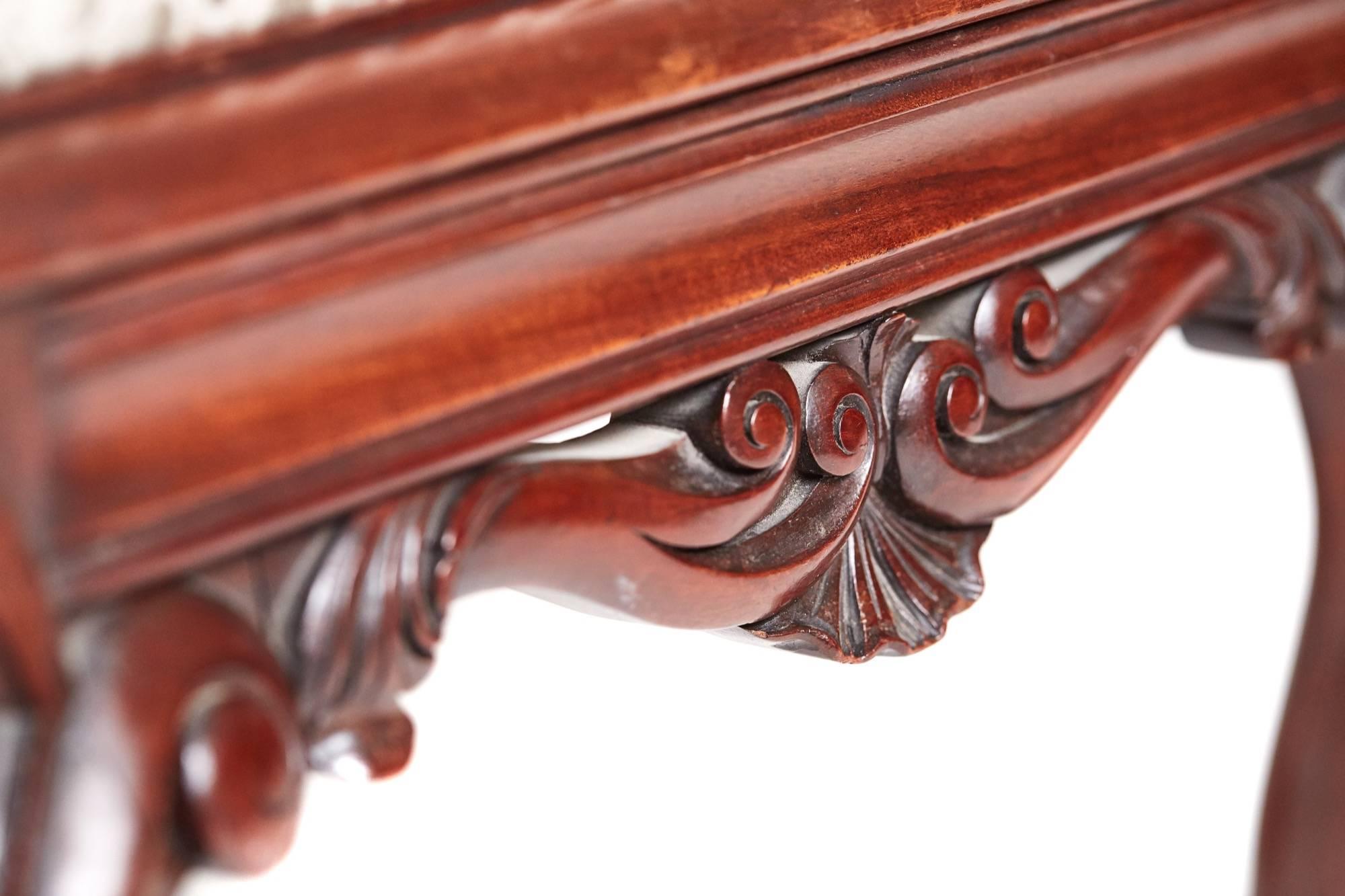 A Victorian carved mahogany freestanding stool, with a newly recovered drop in seat, lovely reeded carved frieze, supported by four shaped cabriole legs.

Lovely color and condition.