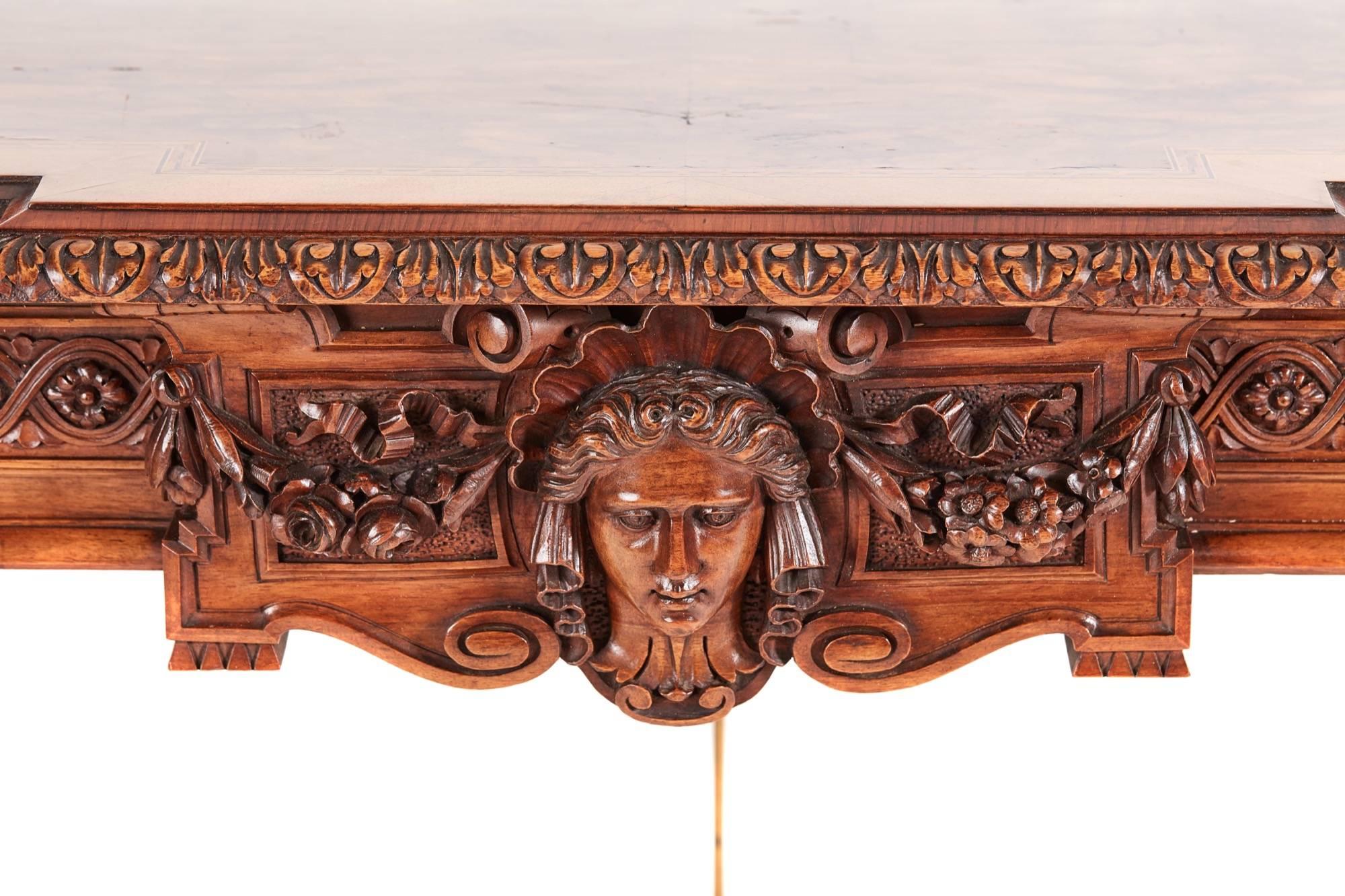 A fine and rare pair of French carved walnut console tables, with quality burr walnut tops, inlaid chequered banding, crossbanded in walnut with a fine carved edge, an amazing carved solid walnut frieze to the centre of the frieze is a beautiful