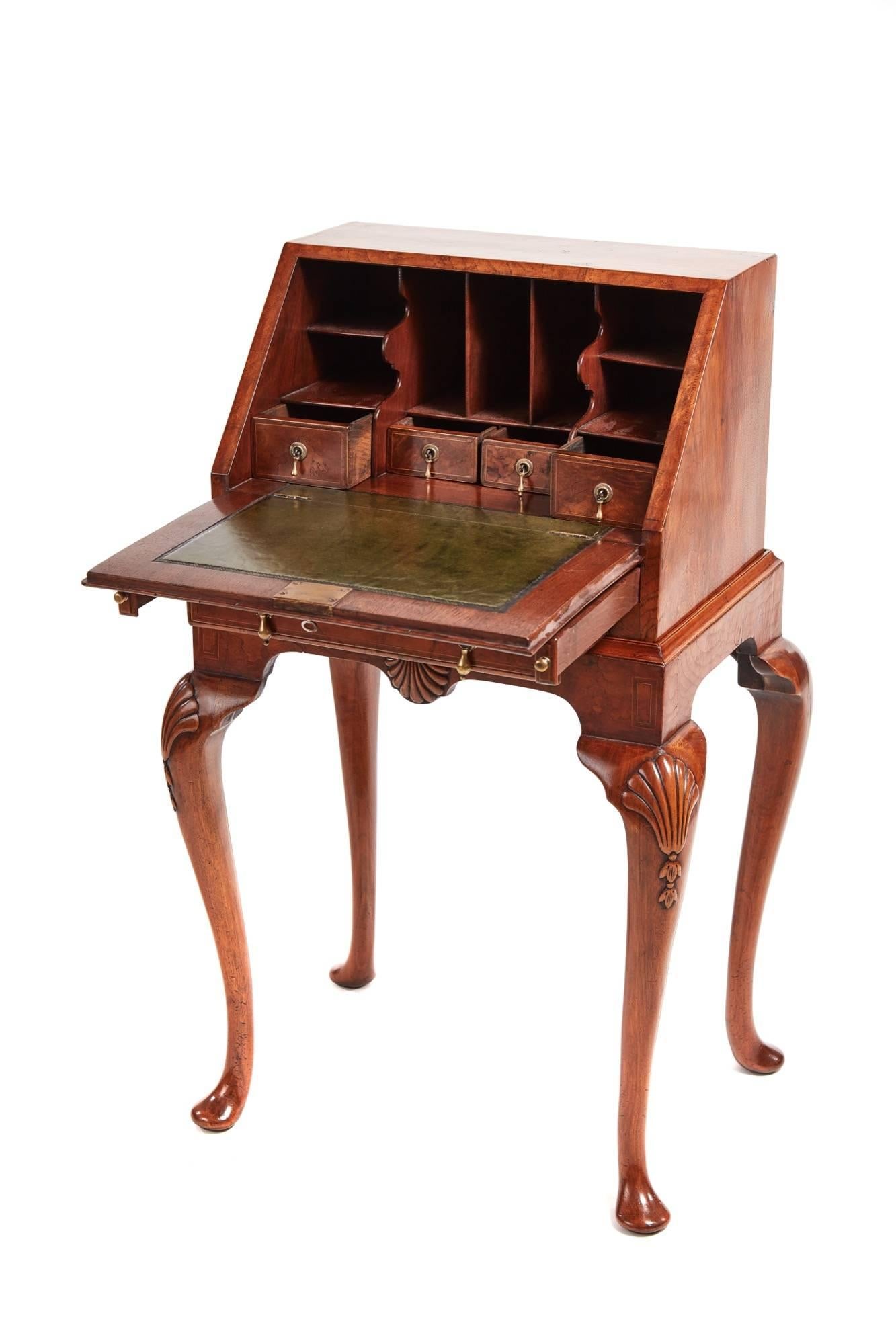 Attractive queen anne style burr walnut bureau, the top, fall and drawer all with herring bone inlay on fine burr walnut, the fall opens to reveal four drawers with original brass handles, a green leather, and shaped pigeon holes, one front drawer