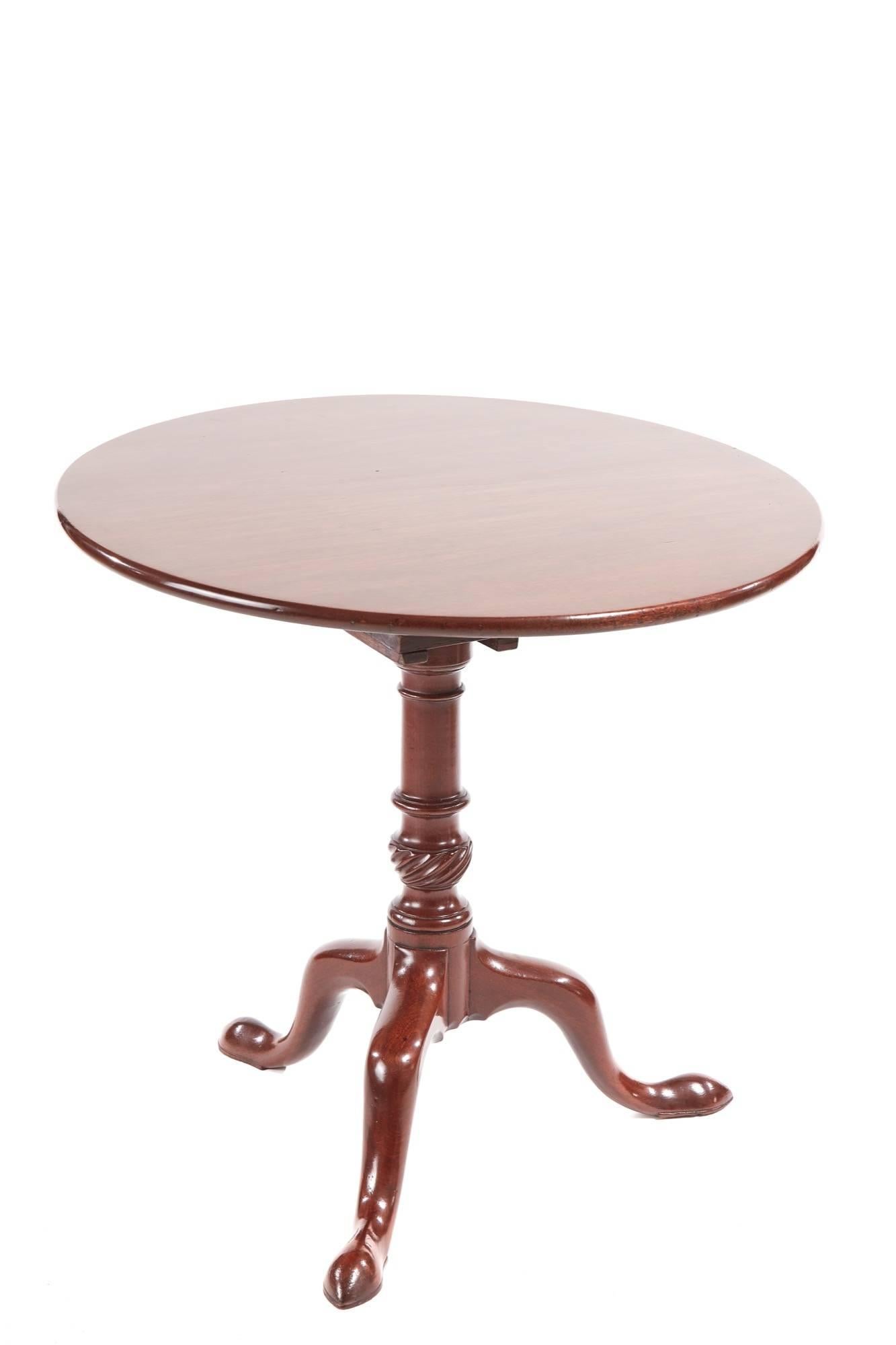 George III mahogany tripod table, with a round solid mahogany top on a revolving birdcage block over a turned and reeded pedestal, raised on three shaped cabriole legs with pad feet
Lovely colour and condition.