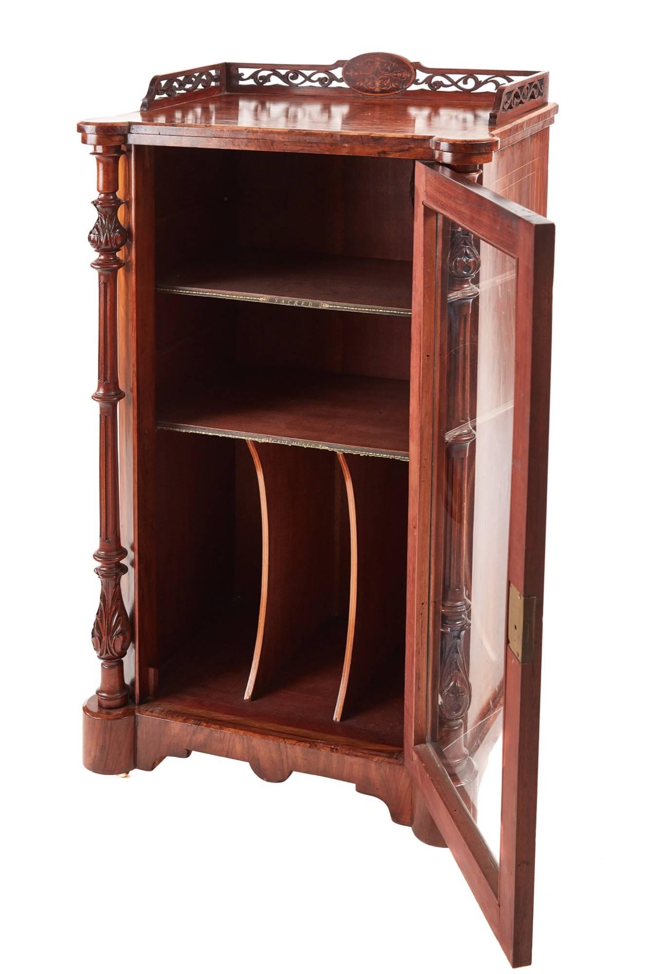 Good quality Victorian inlaid burr walnut music cabinet, having a pierced fretwork and inlaid gallery, lovely inlaid top and sides, with front twin carved pillar side supports, single opening glazed door revealing fitted interior, standing on a